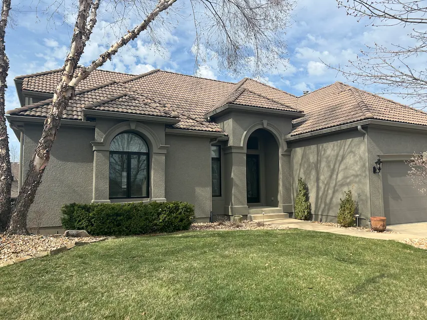 An image of a newly painted home in olive green.