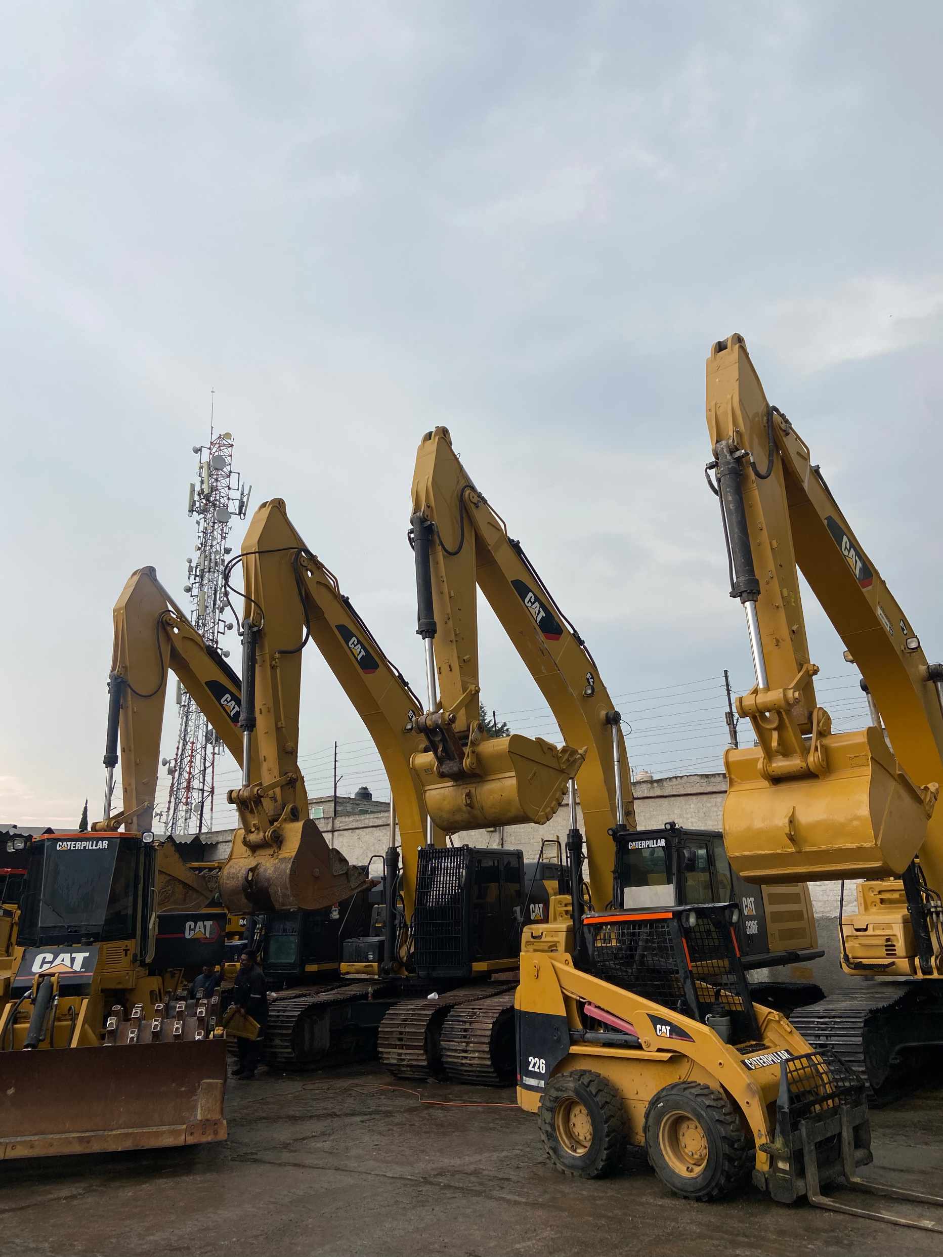man wearing gray polo shirt beside dry-erase board