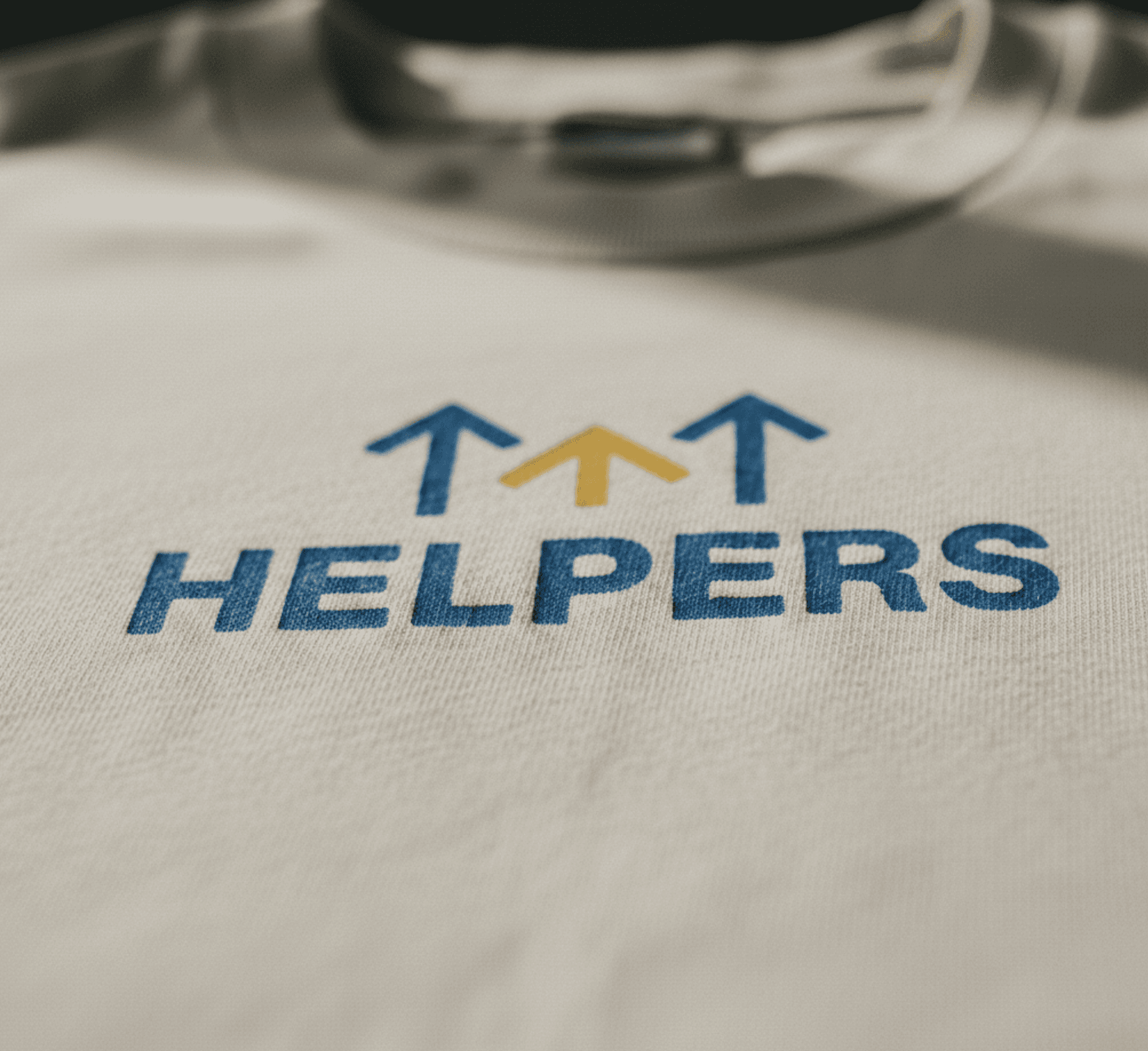 Close up of volunteer, "helpers" t shirt used for charity event