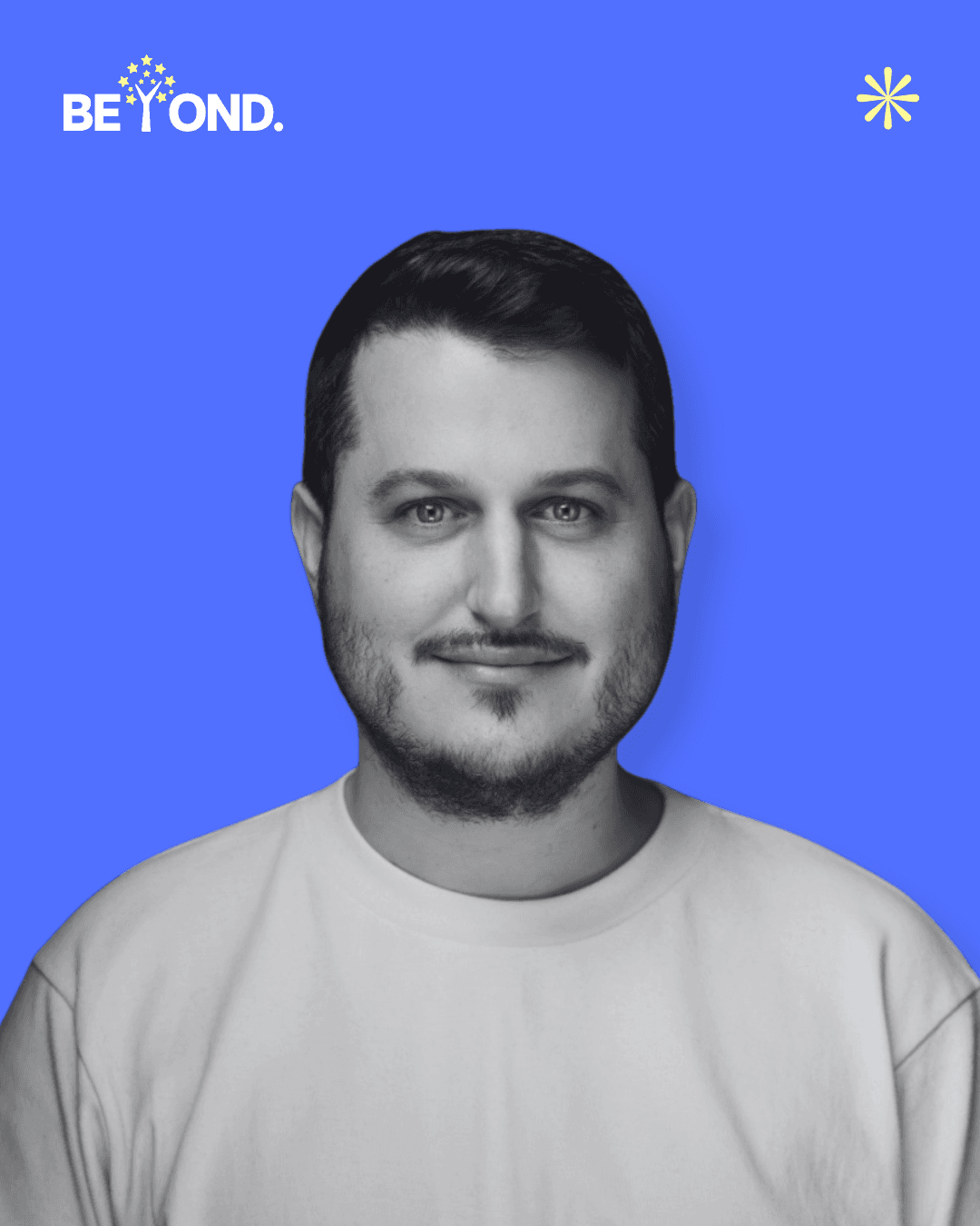 A confident person with short, styled hair and a leather jacket poses against a dark backdrop.