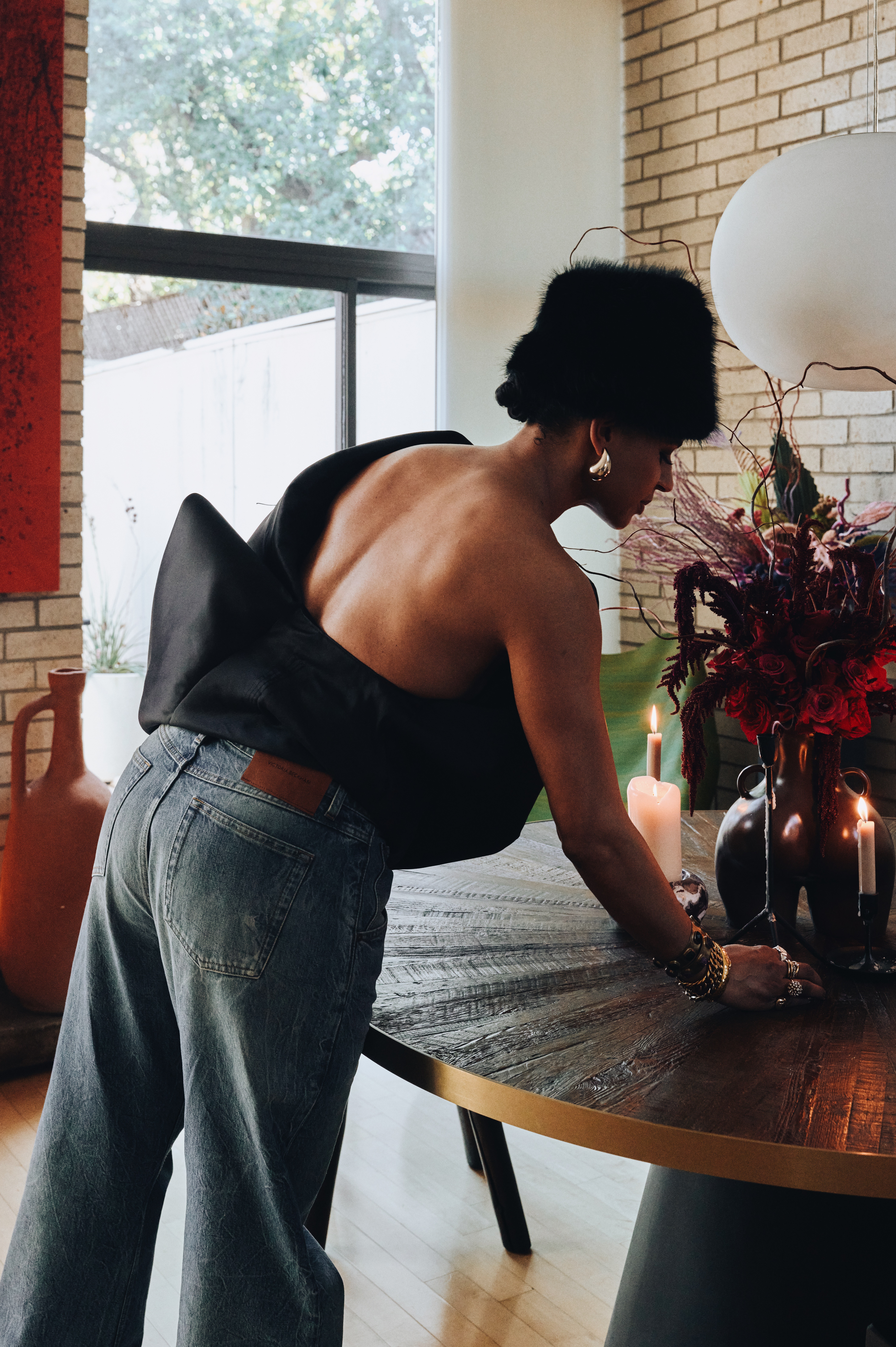Side profile of  Ashley Griffin with flowers