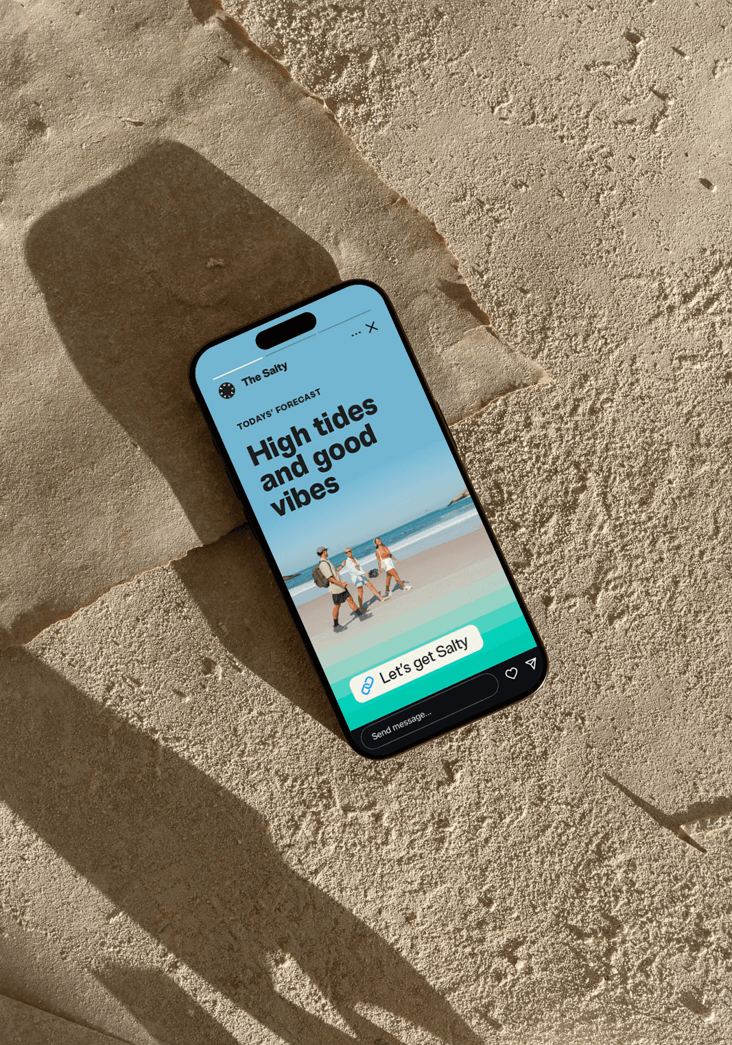 Vertical Instagram story graphic with the new The Salty logo at top, a large headline promoting retreats, and a full-bleed beach photograph background with a call-to-action sticker for booking