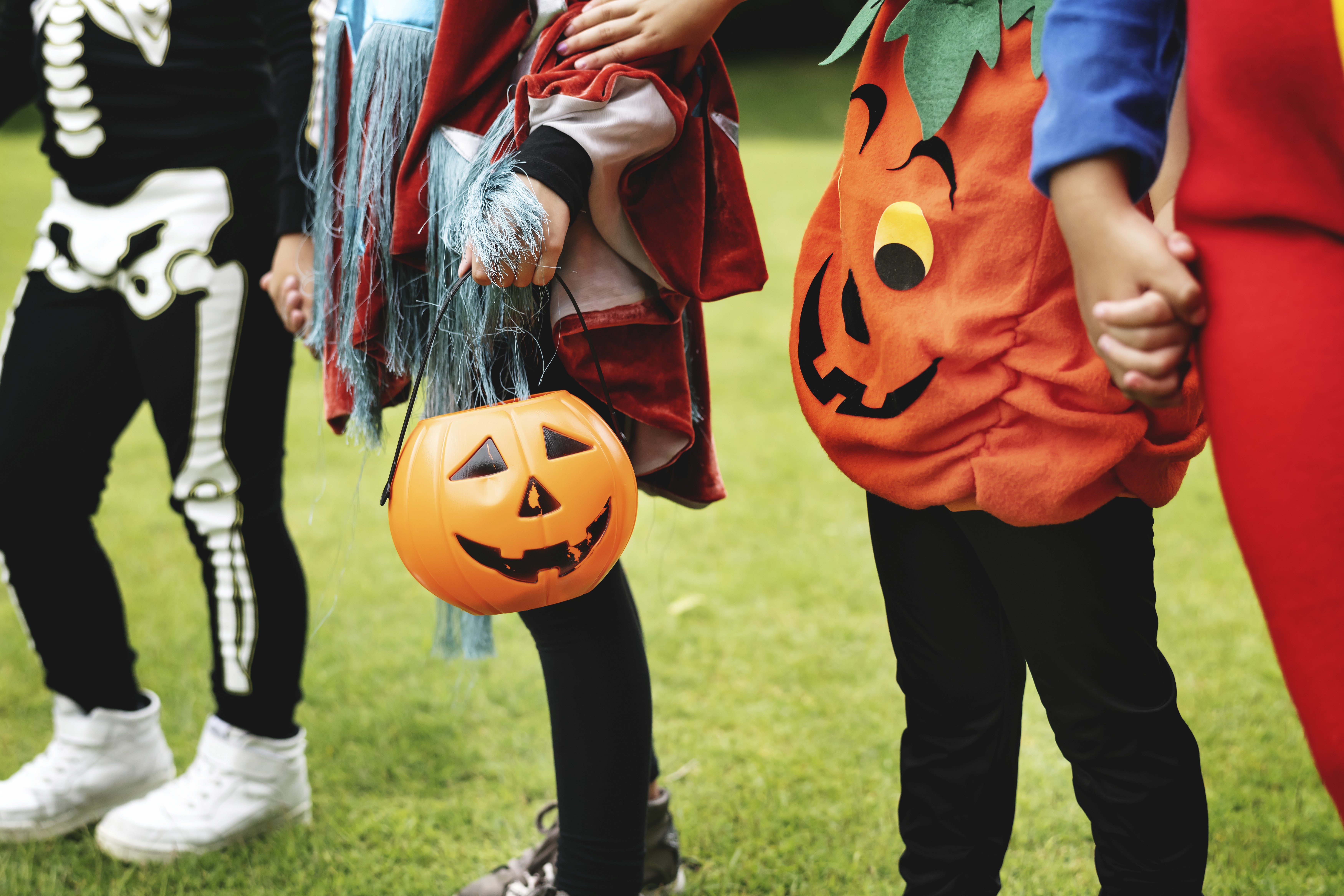 Little children trick or treating on halloween