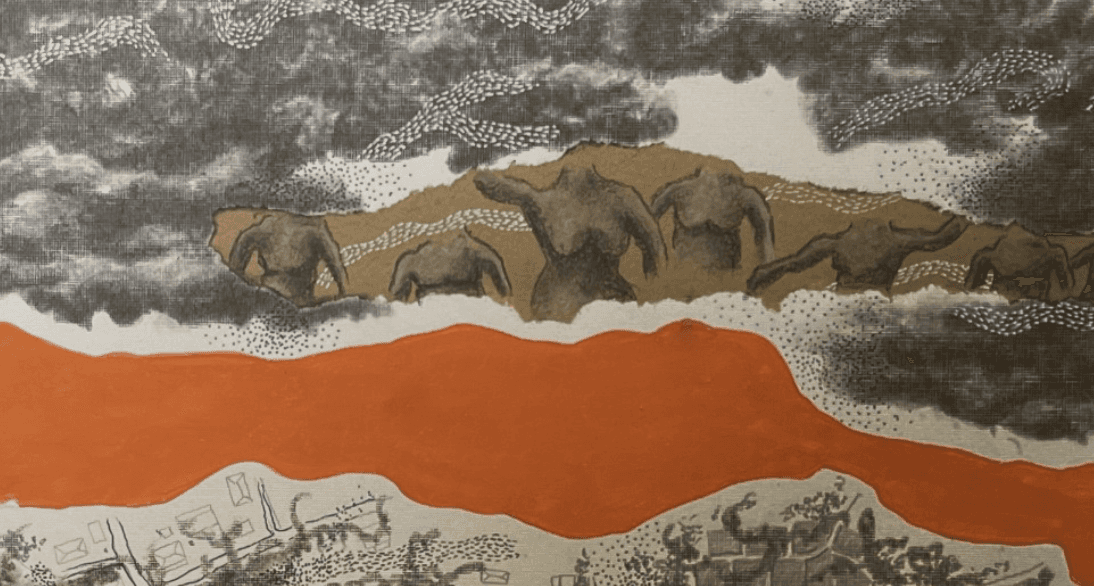 A man playing a drum in front of a group of people