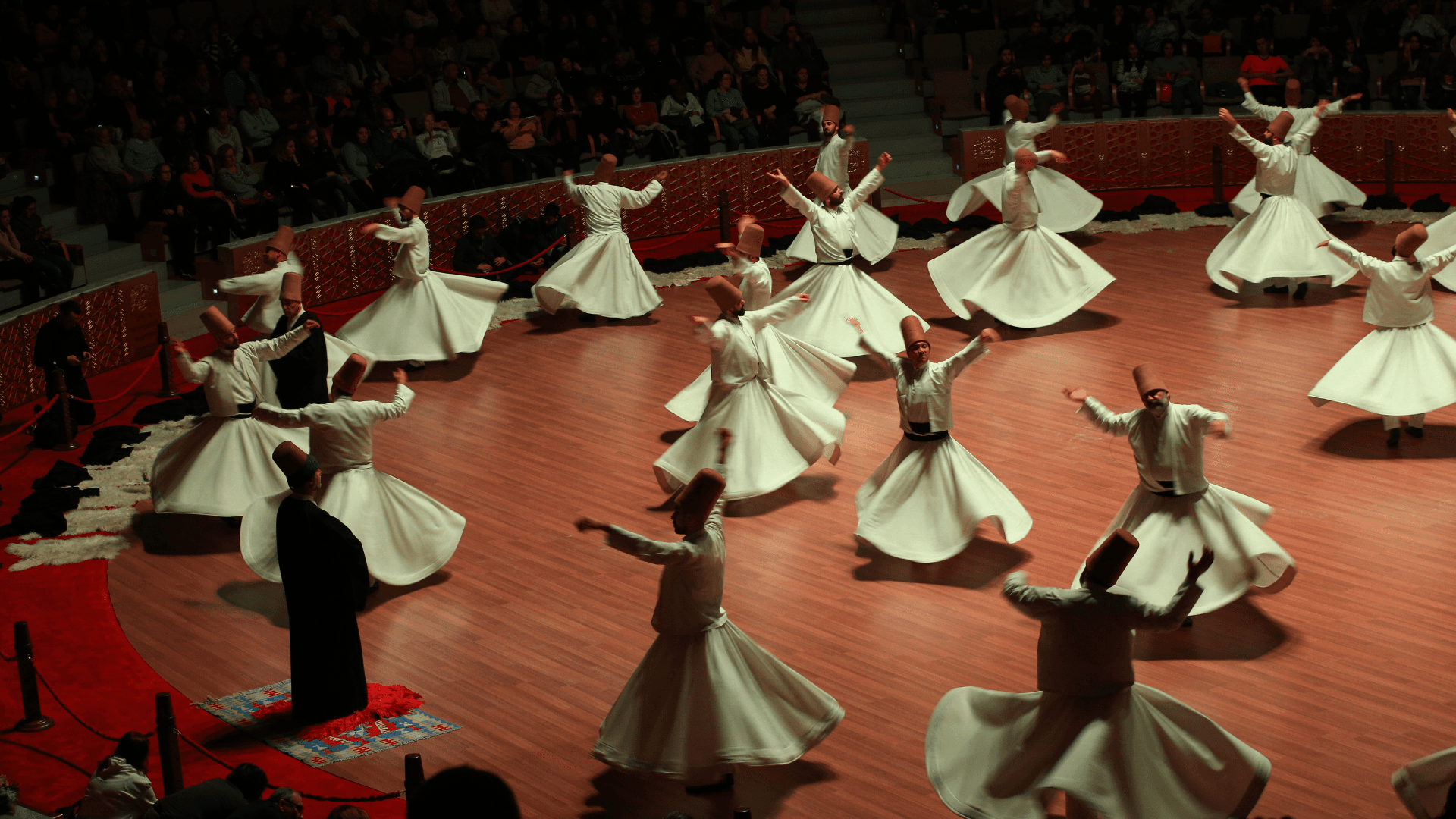 Whirling Dervish ceremony in Konya, Türkiye, Sufi performers spinning in traditional white robes during a spiritual Mevlevi dance performance