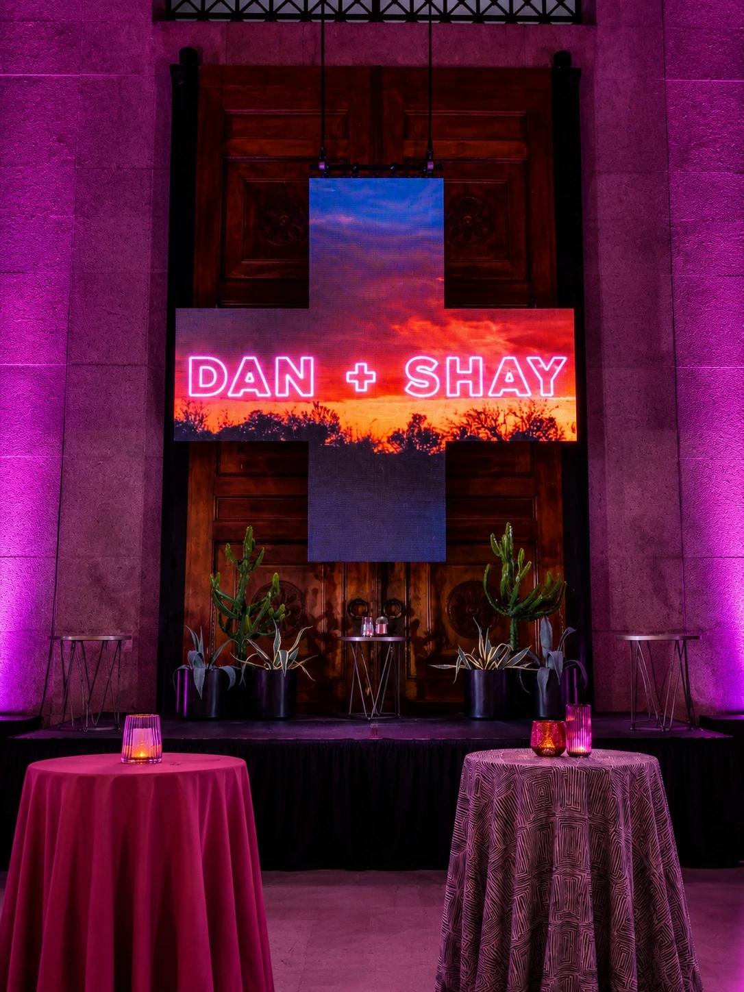 'Dan + Shay' LED screen over cocktail tables with burgundy linens at Nashville's Parthenon — concert lighting and video by UpLight Technologies