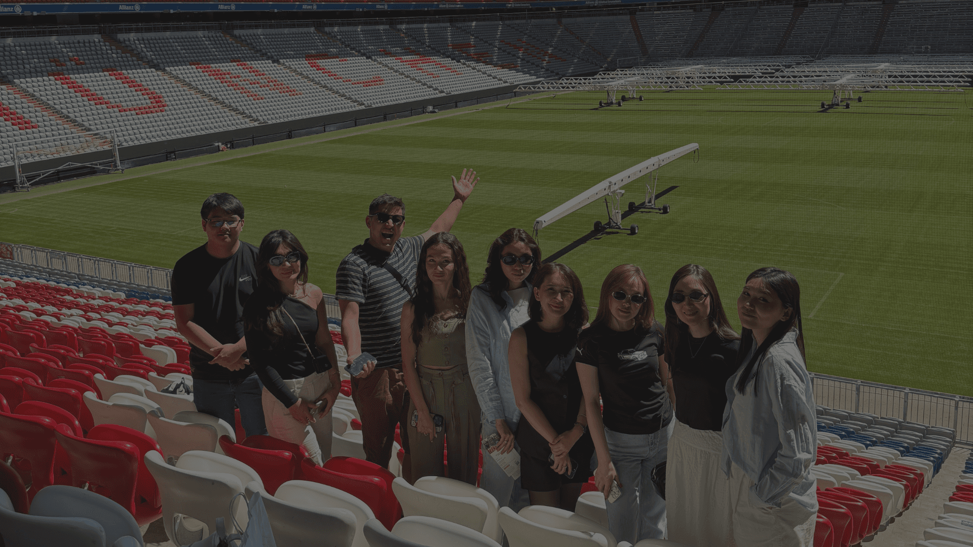 two people sitting on a bench looking at a mountain