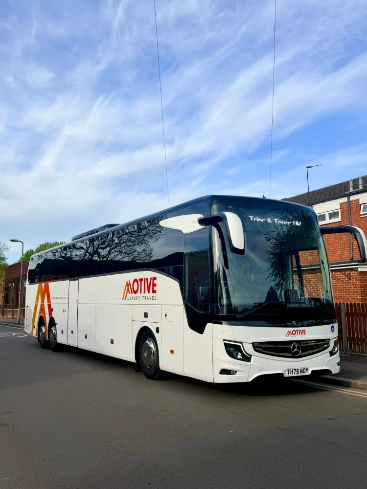 Luxury coach and minibus fleet used for city tours and private transfers, showcasing premium travel services and modern design in urban and scenic environments