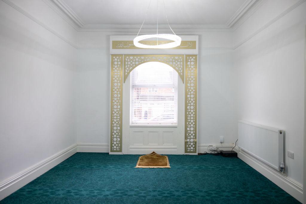 a black and white living room with a large tv