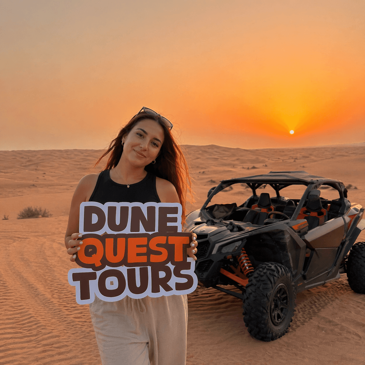 Charlotte Blackwell posing on a red quad bike during her Dune Quest Tours experience, rated the best luxury Desert Safari 2026
