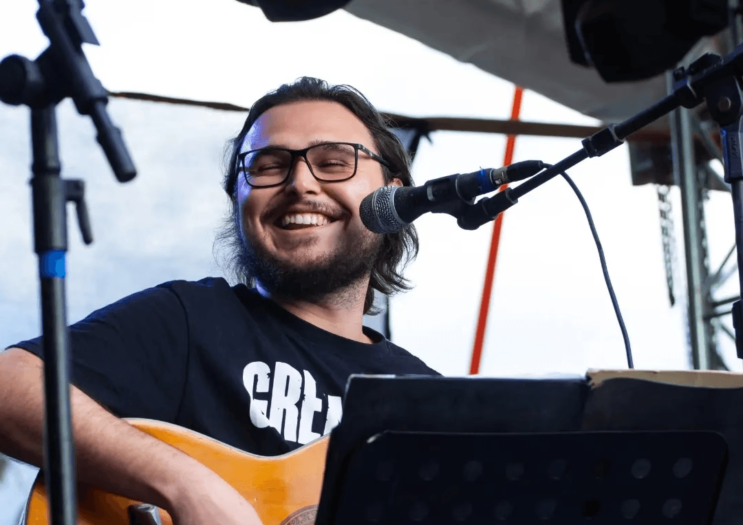 man standing near balcony