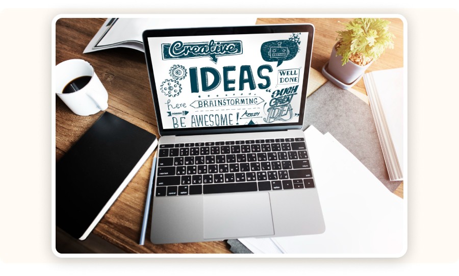 Laptop showing a “Creative IDEAS” illustration