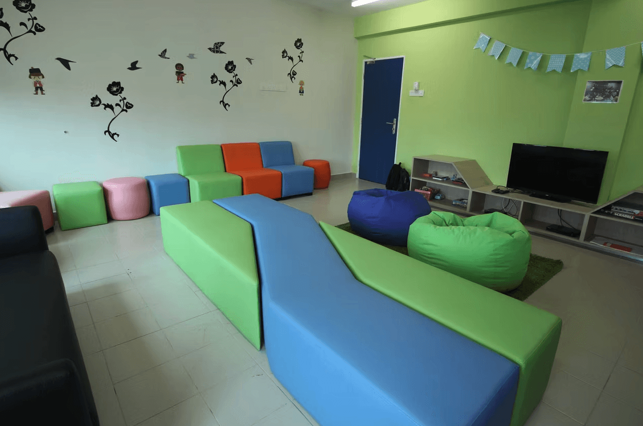 a restaurant with a large table and chairs