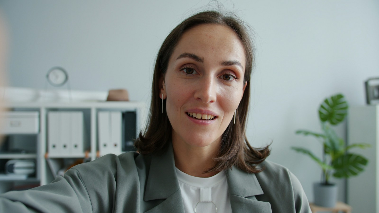 A busy professional joining a nutrition video appointment from her home office.