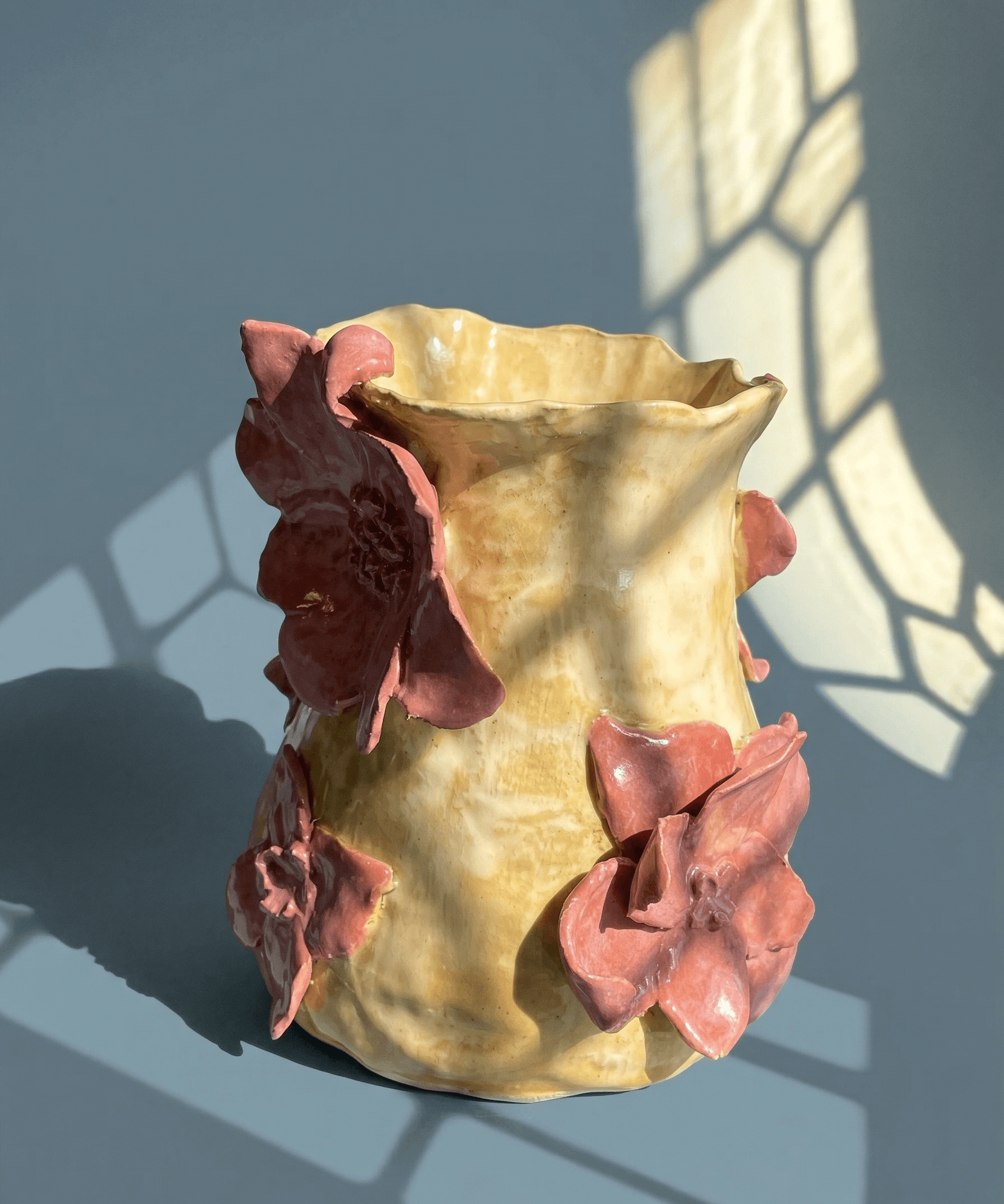 a vase with floral decodations
