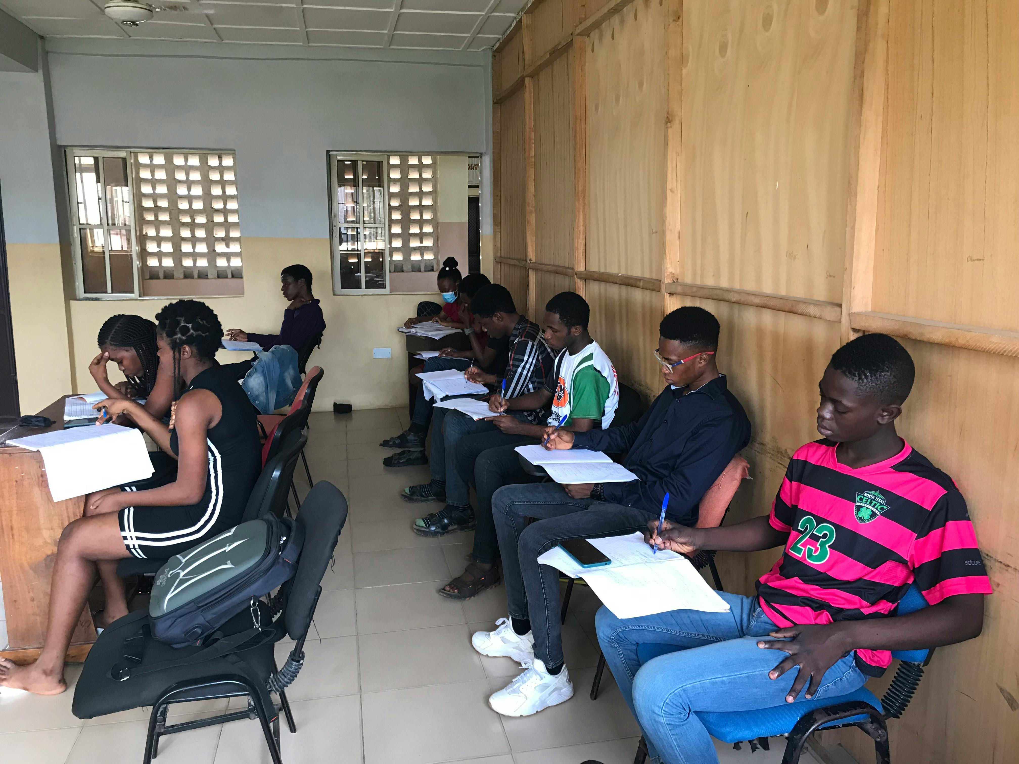 man in black crew neck t-shirt using macbook