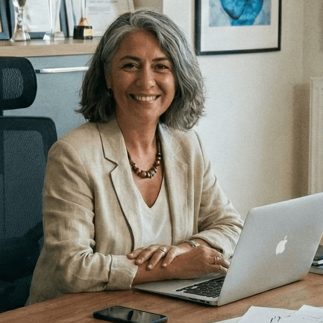 smiling woman wearing white and black pinstriped collared top