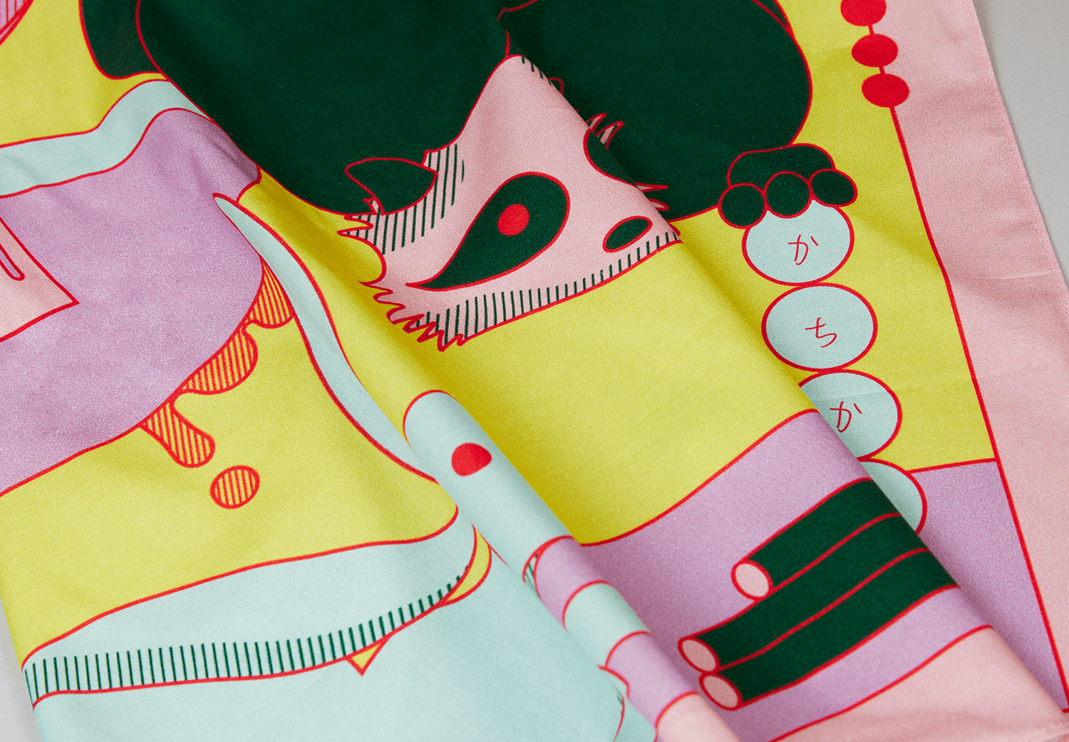 Detail of the Wrap a Tale furoshiki illustration inspired by Japanese folklore, showing bold colors and character elements.