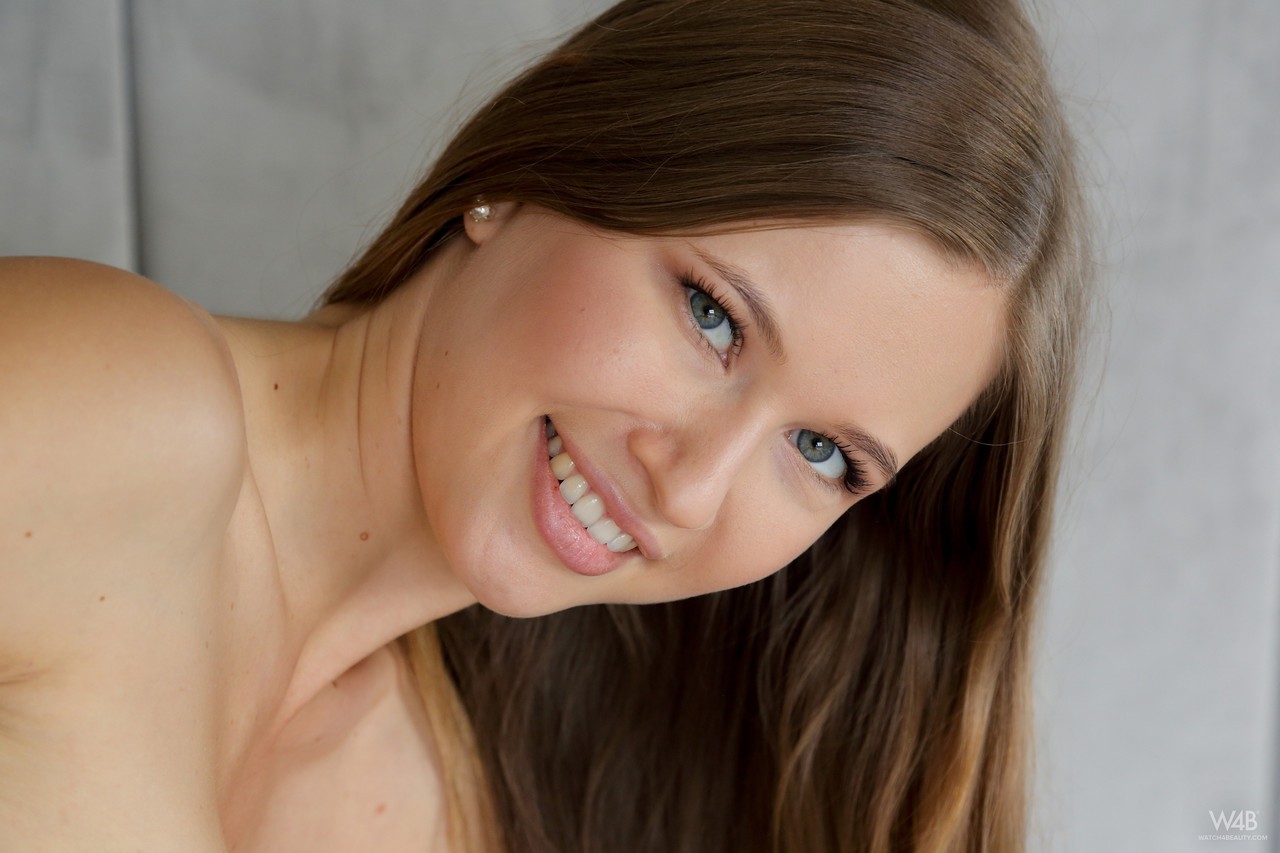 kids lying on a glass land and smiling