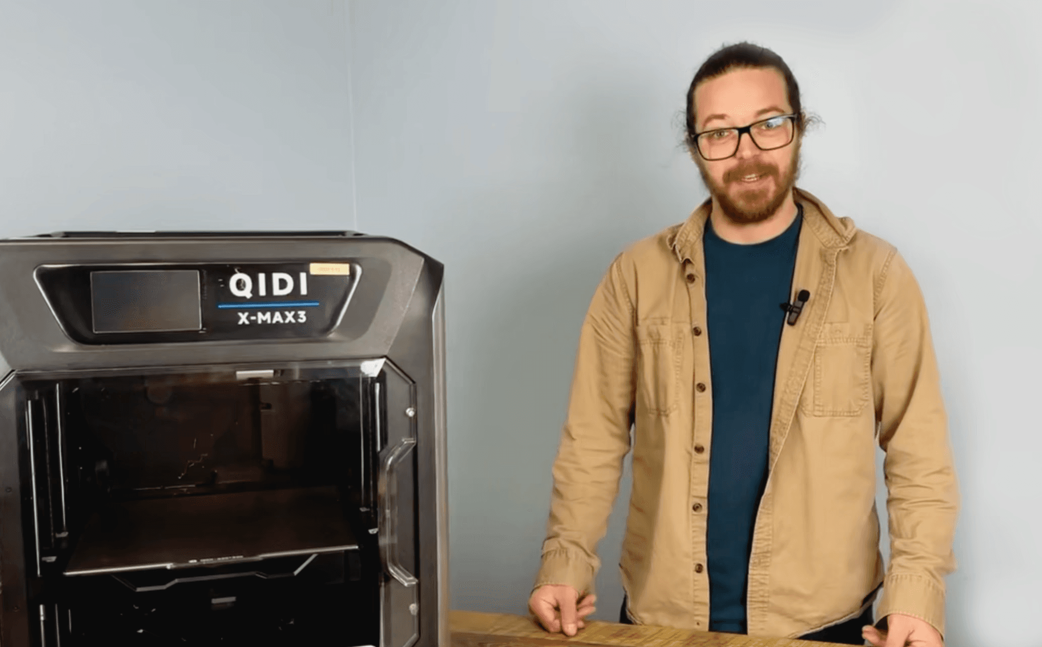 guy standing next to qidi printer