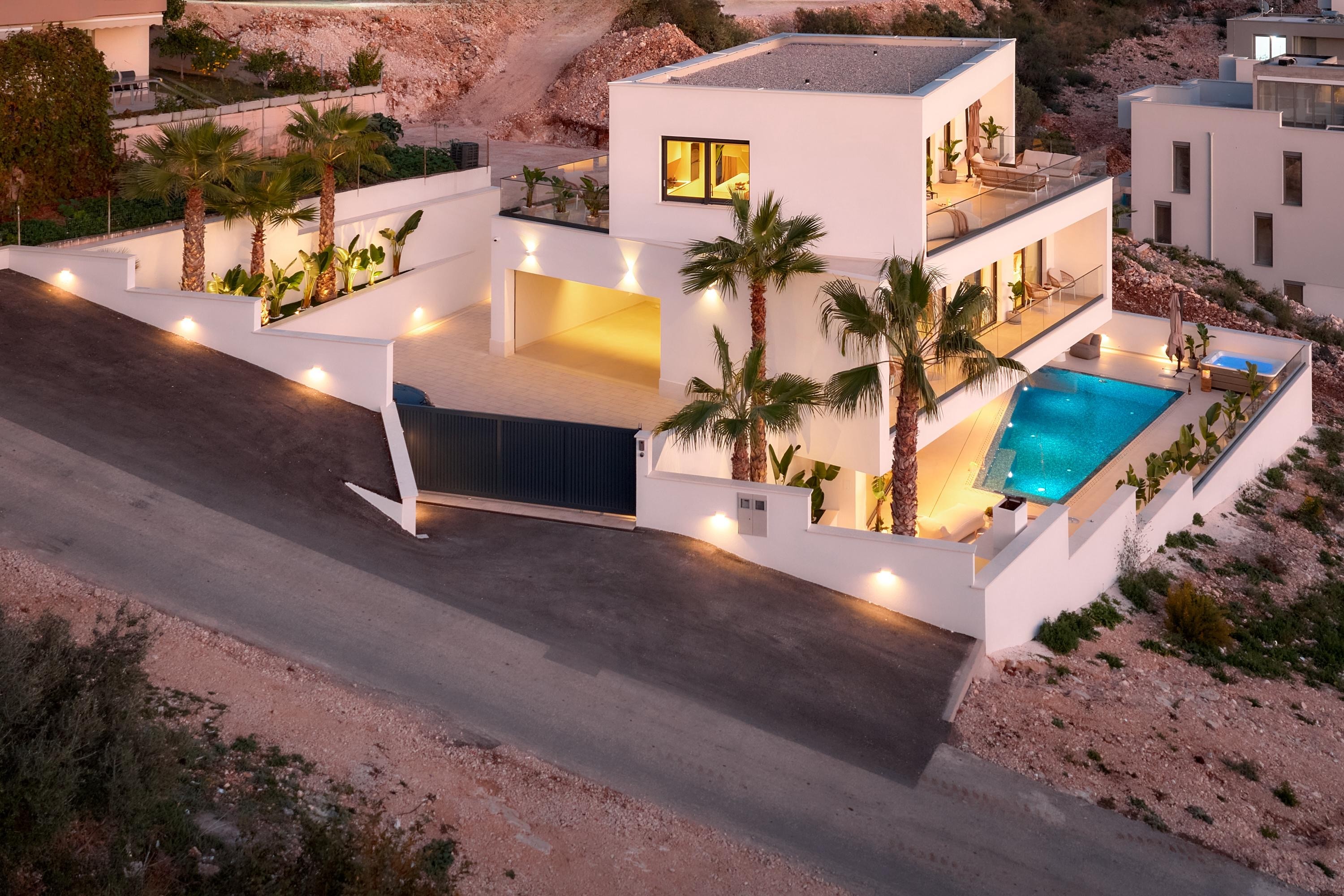 Bedroom with wall bookshelf and mountain view.