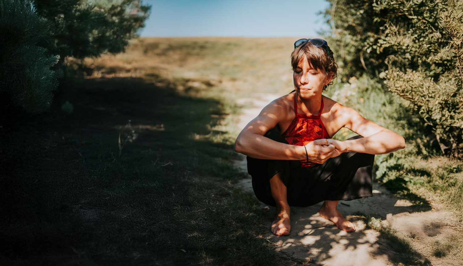 Reflective yoga instructor in nature