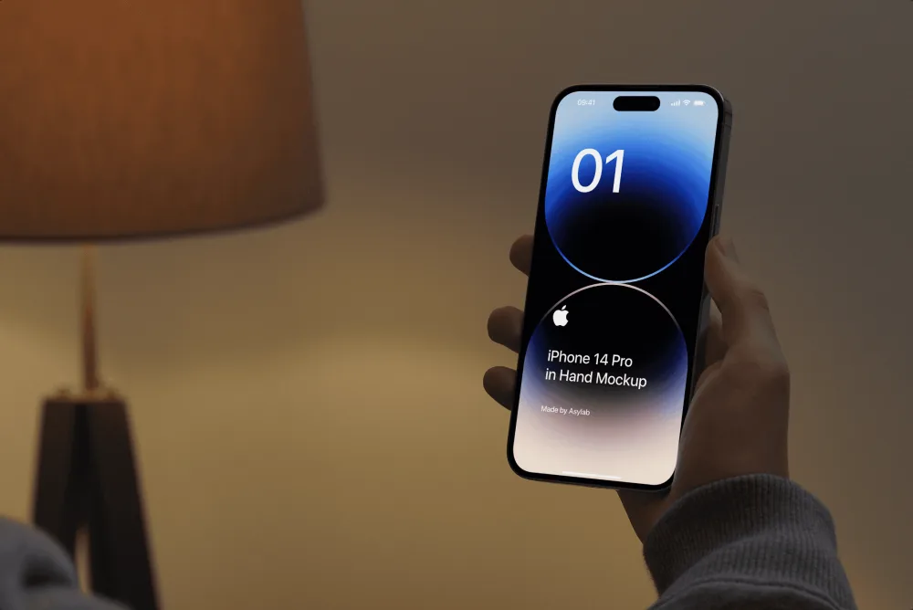 A hand holding an iPhone 14 Pro with a sleek dark screen and illuminated circles, set in a dimly lit interior with a warm lamp in the background.