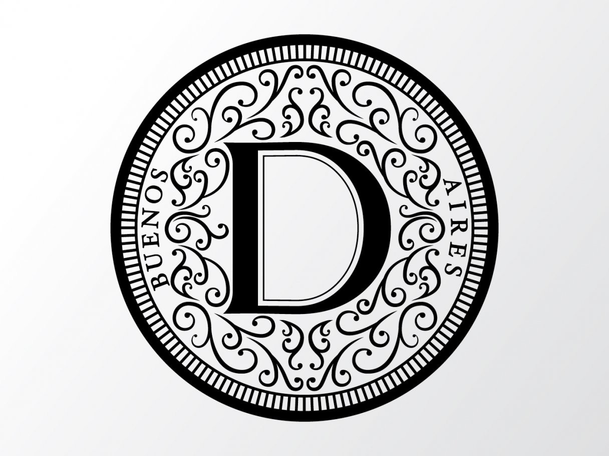 Rustic cabin in a golden field at sunset