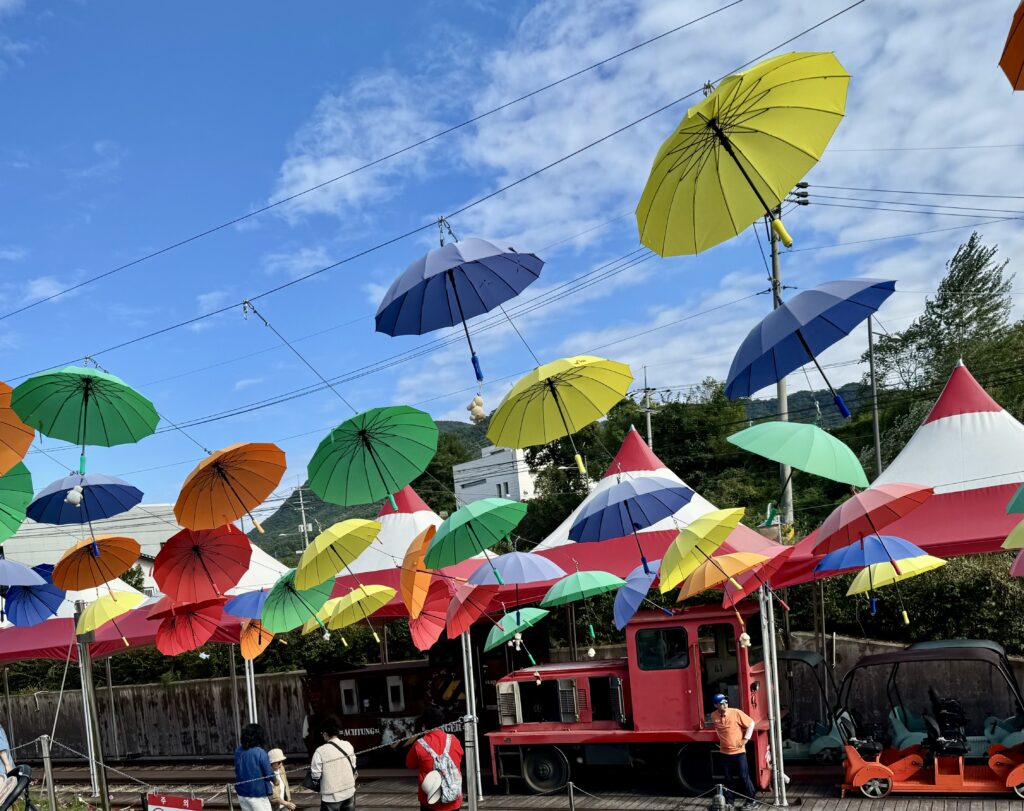The colourful umbrellas at Gangchon rail park station