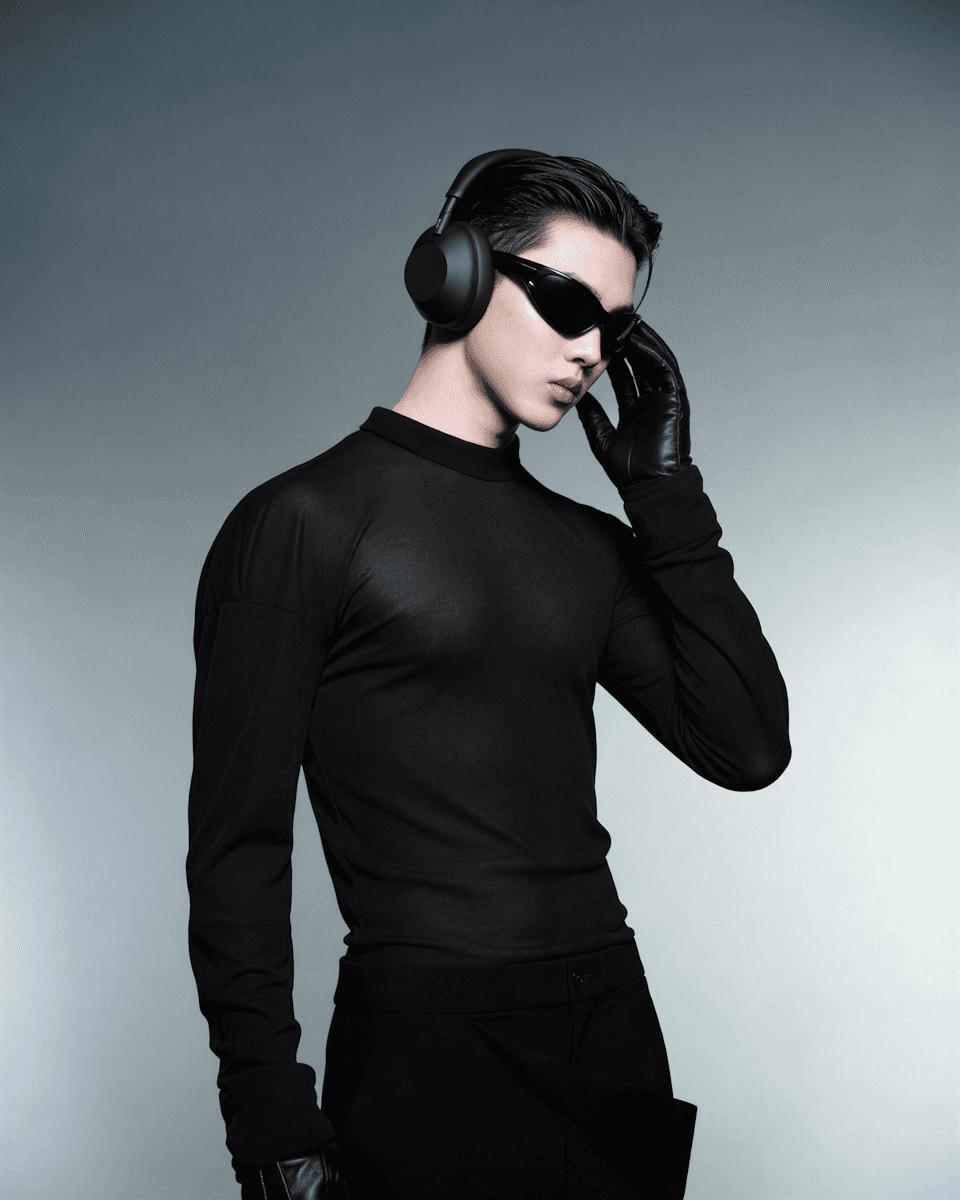 man posing in black attire