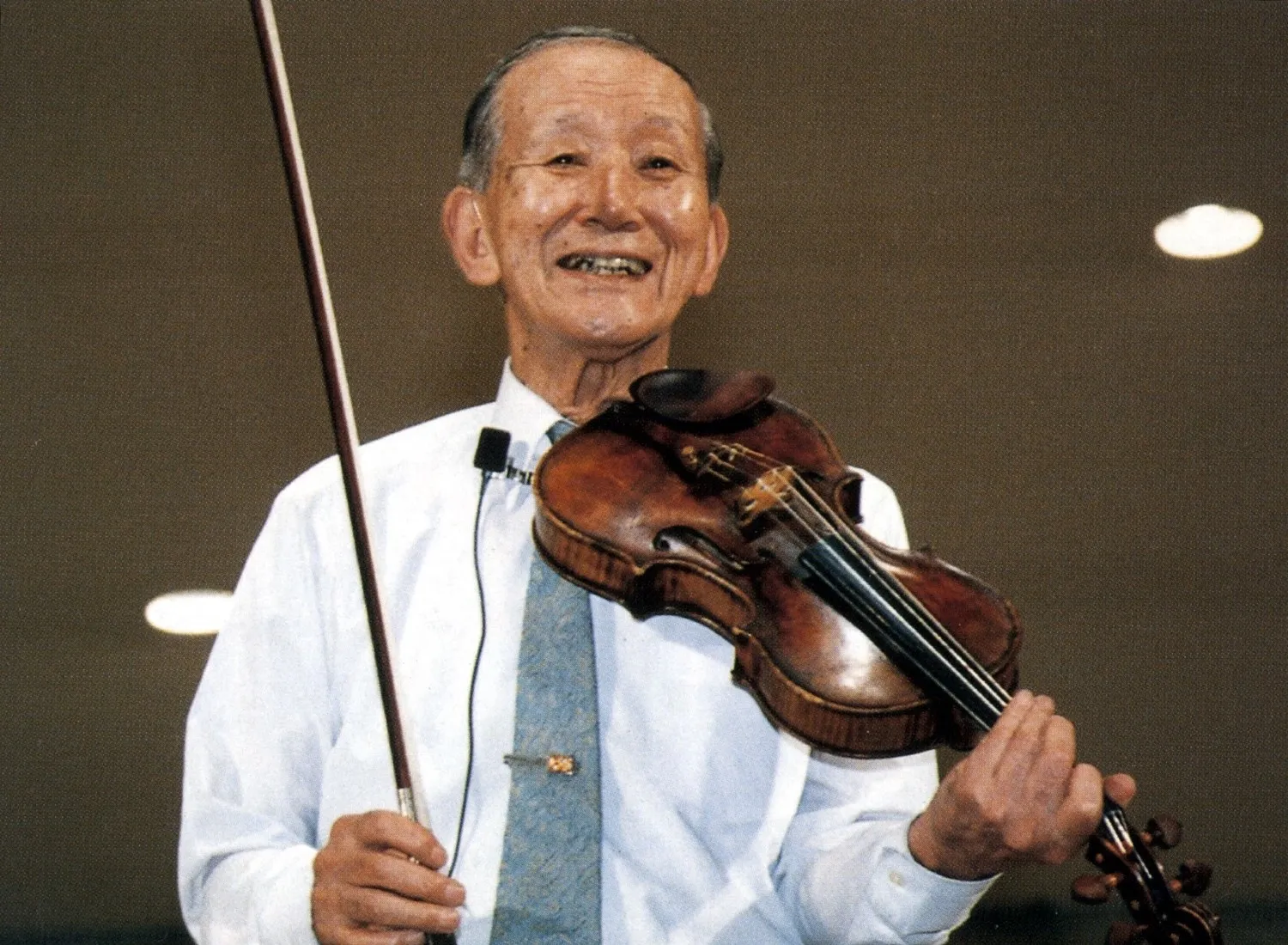 baby playing multicolored xylophone toy