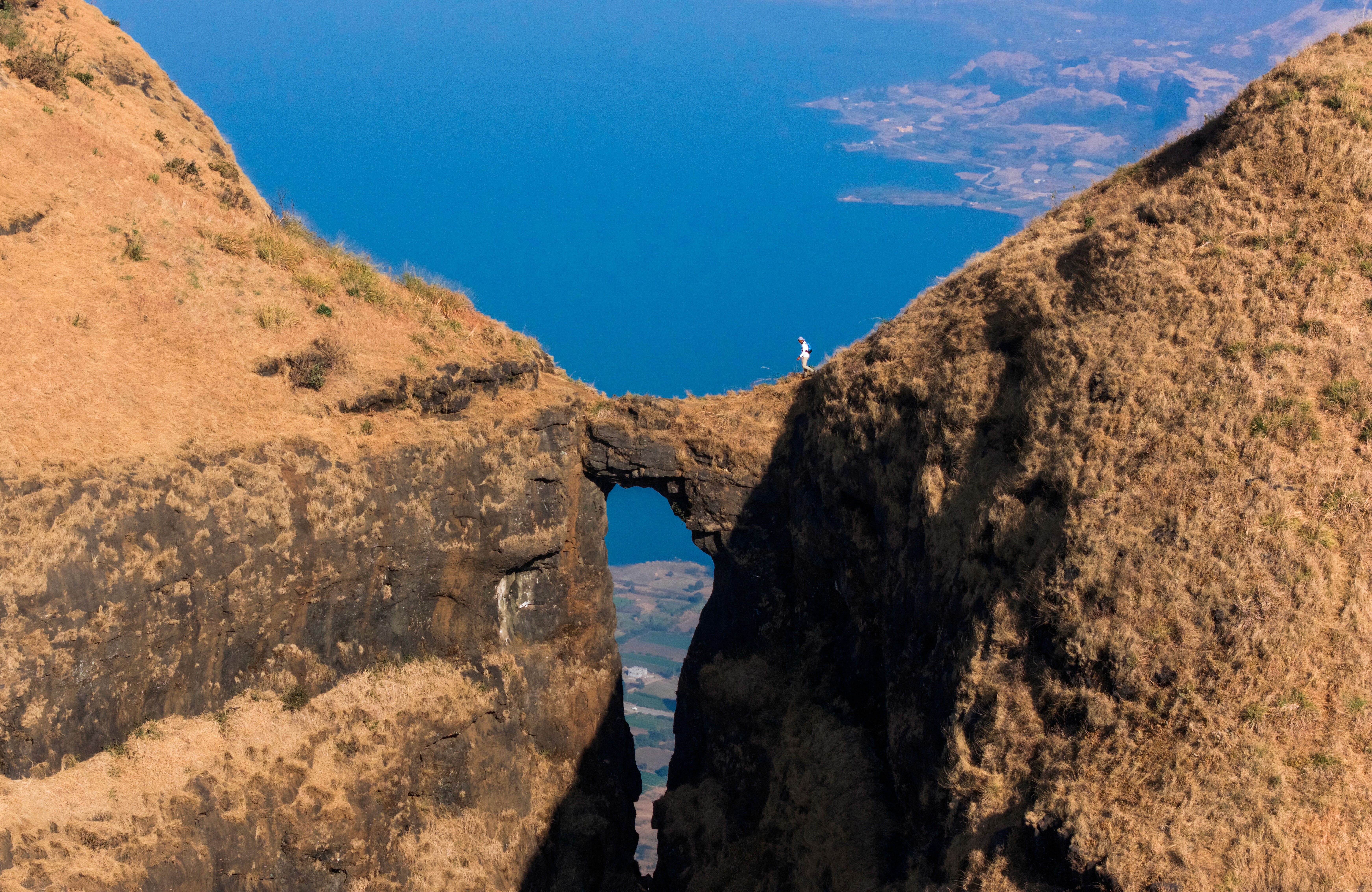 person on top of mountain during daytime