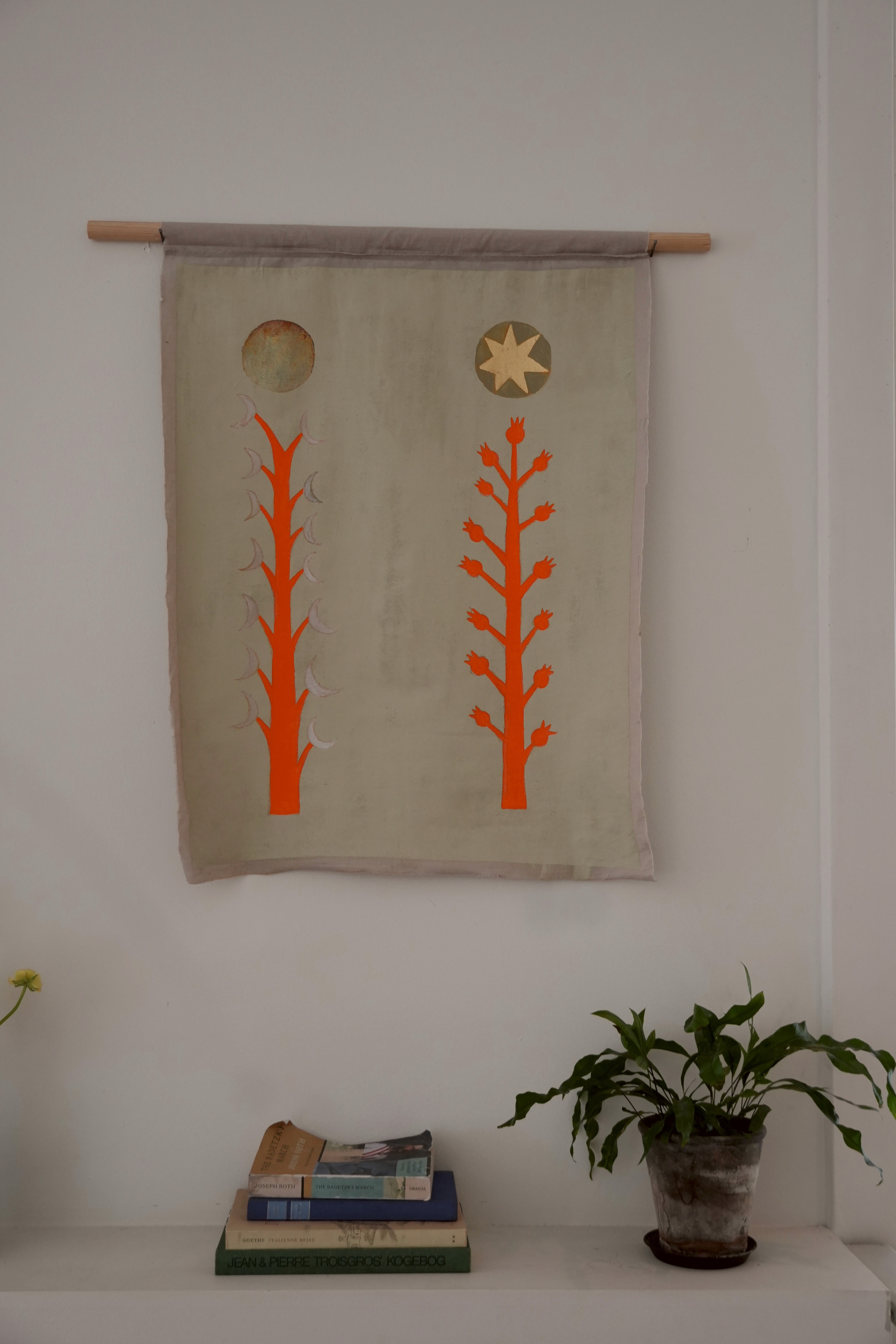 Young woman looking out a window at night