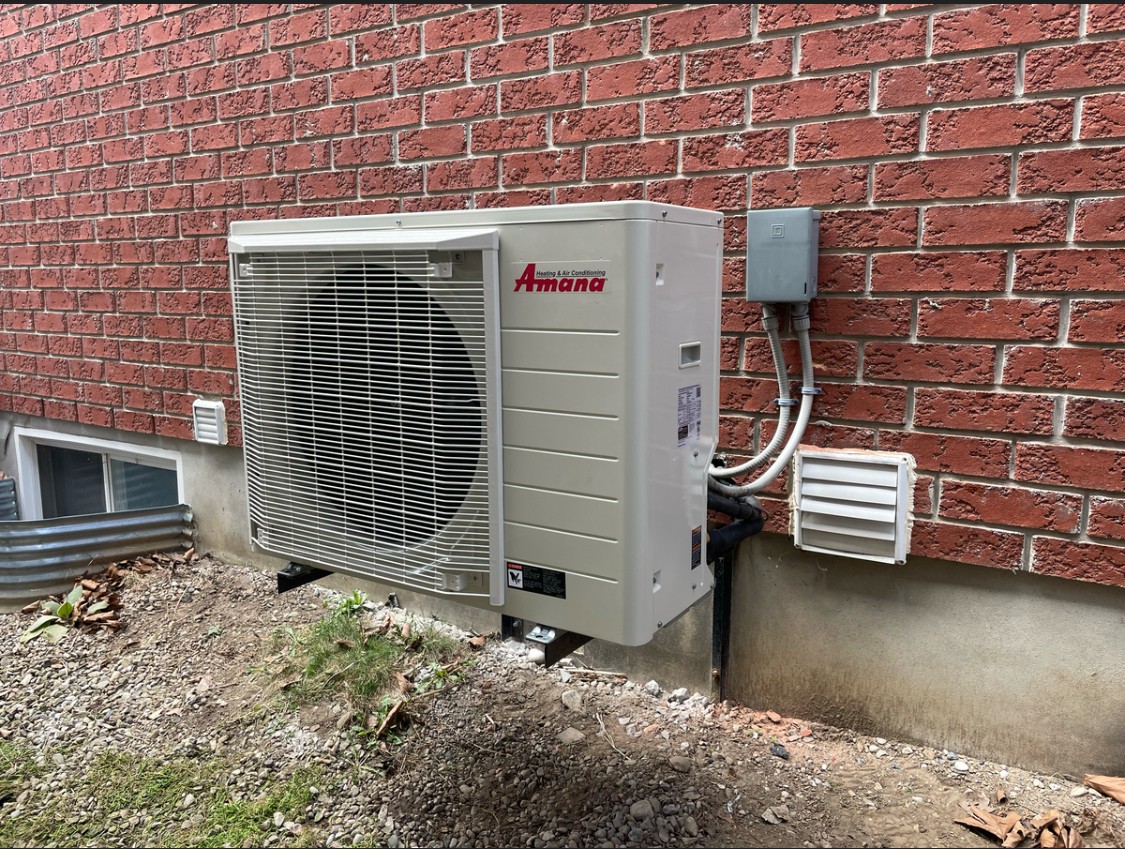 Amana cold-climate heat pump in Guelph. 1-day install, $7,500 HRS rebate filed by us.