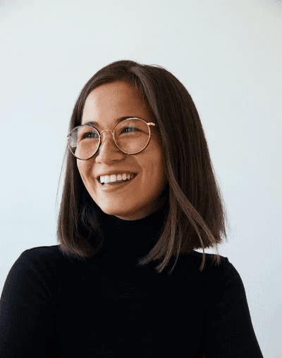 woman in white crew neck shirt smiling