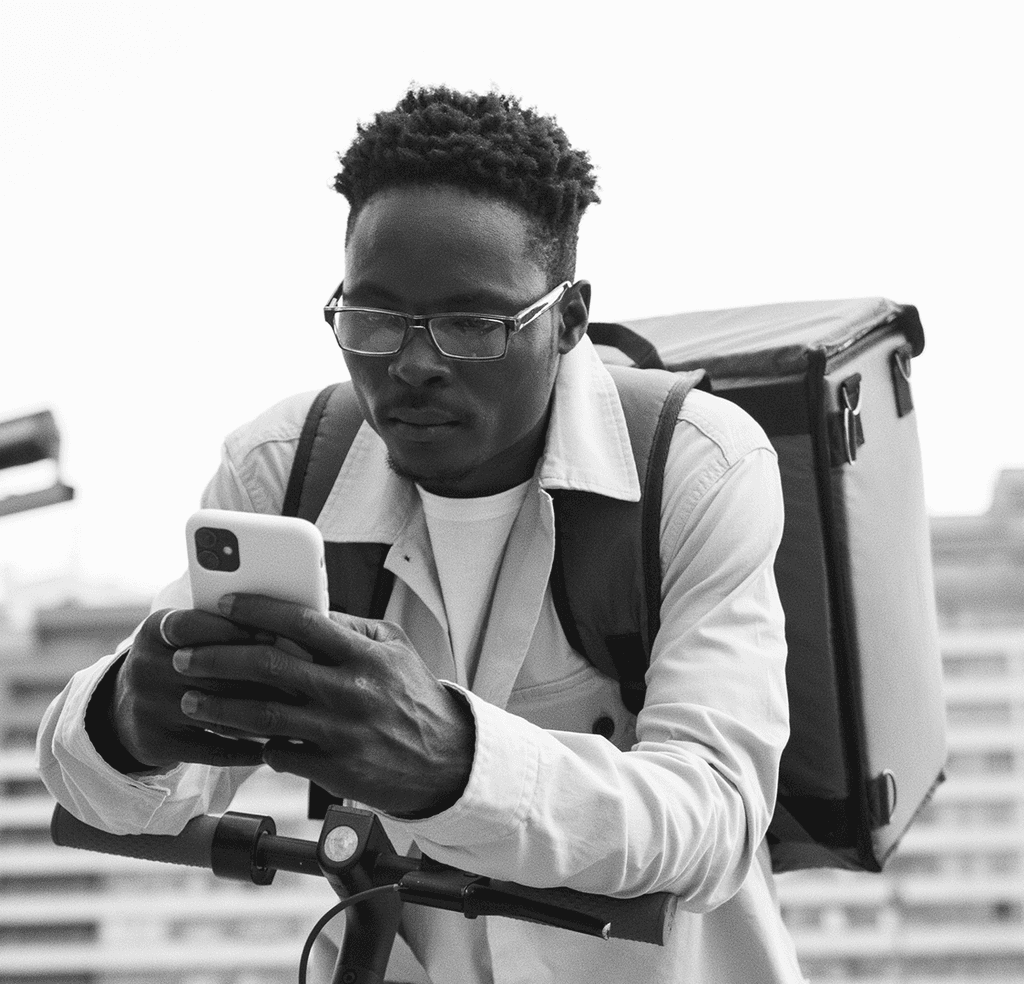 Delivery guy looking at the phone