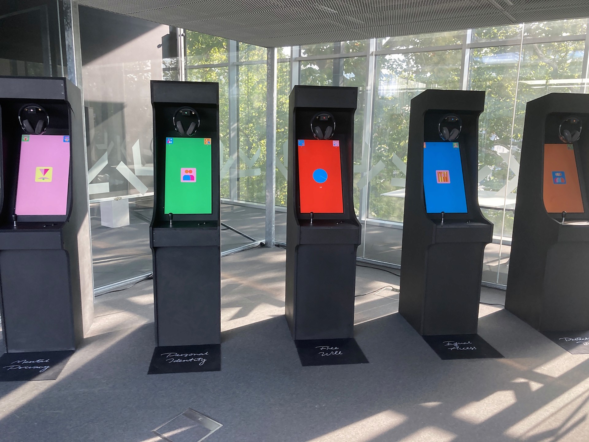 Interactive displays with headphones and colorful graphics.