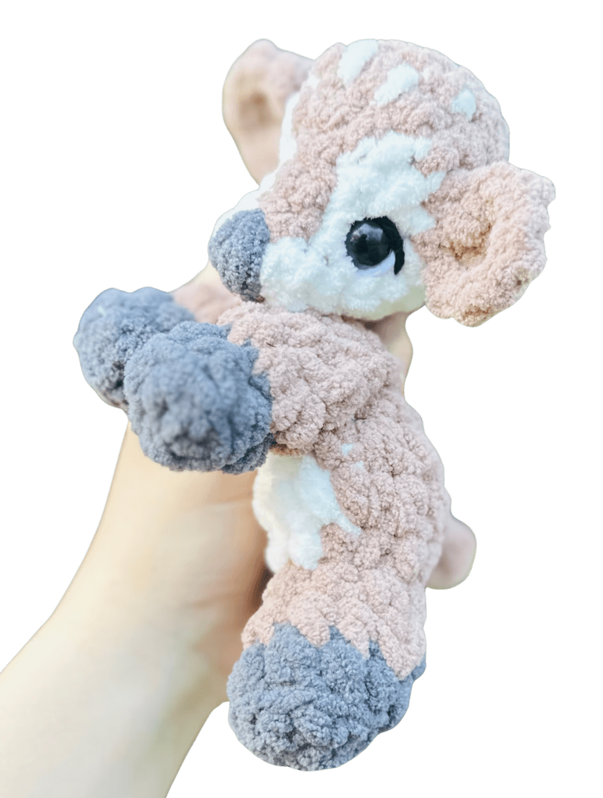 A handcrafted knitted hedgehog toy featuring a soft cream-colored body and intricately detailed, textured brown spines, perfect for children and collectors.
