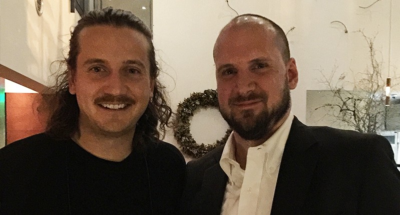 portrait of two men dressed in black