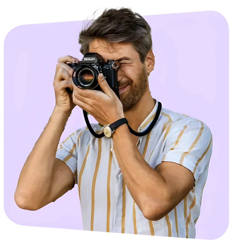 Traveller taking a picture using an analog camera