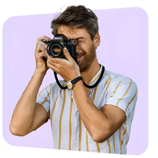 Traveller taking a picture using an analog camera