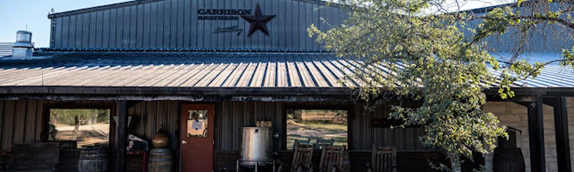 photograph of the outside of garrison brothers distillery in Dallas, Texas.