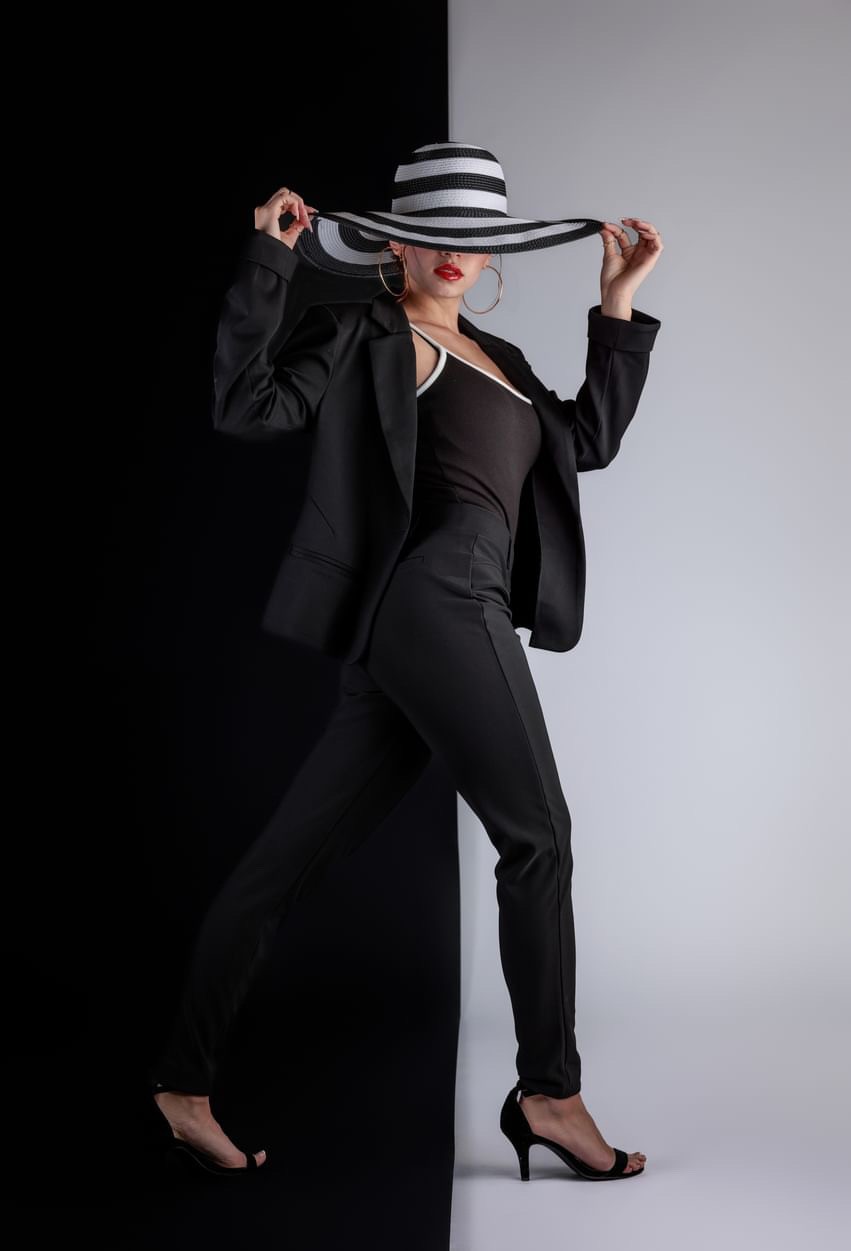 Leila Felix in a polished editorial black suit