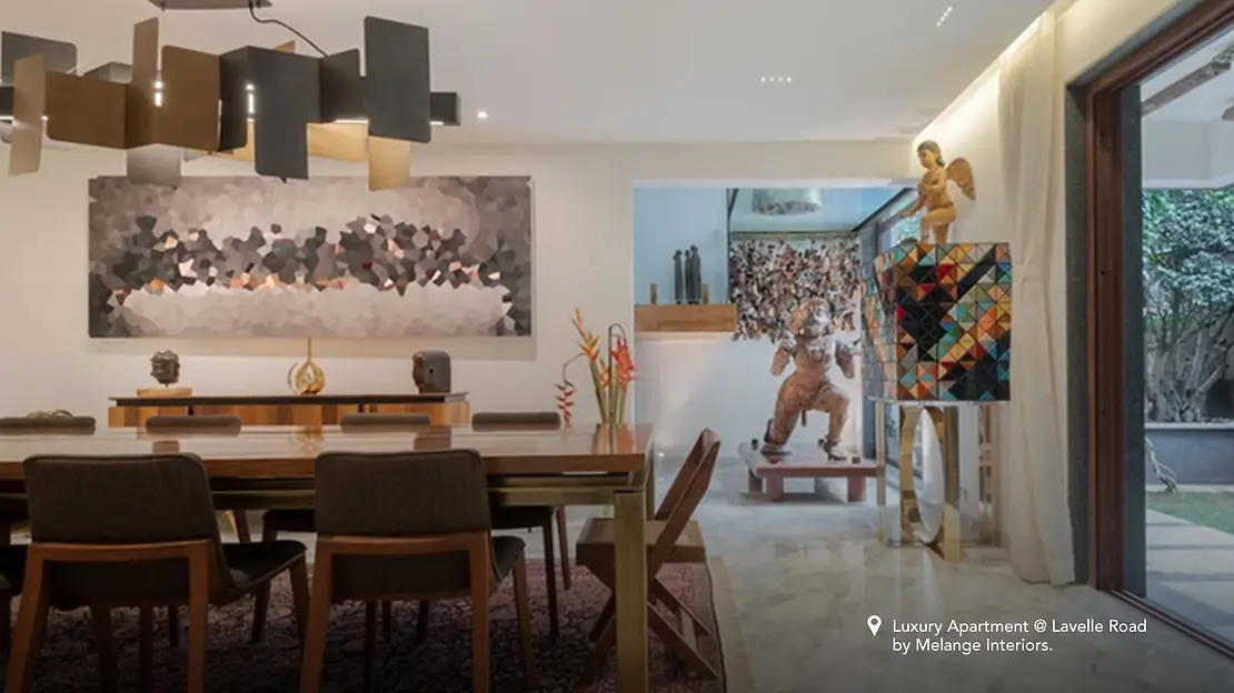 Eclectic-style dining room with a large painting on the wall and decorations.