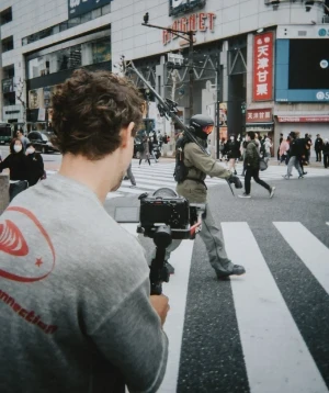 Reilin filming a character in ski gear on the streets of japan