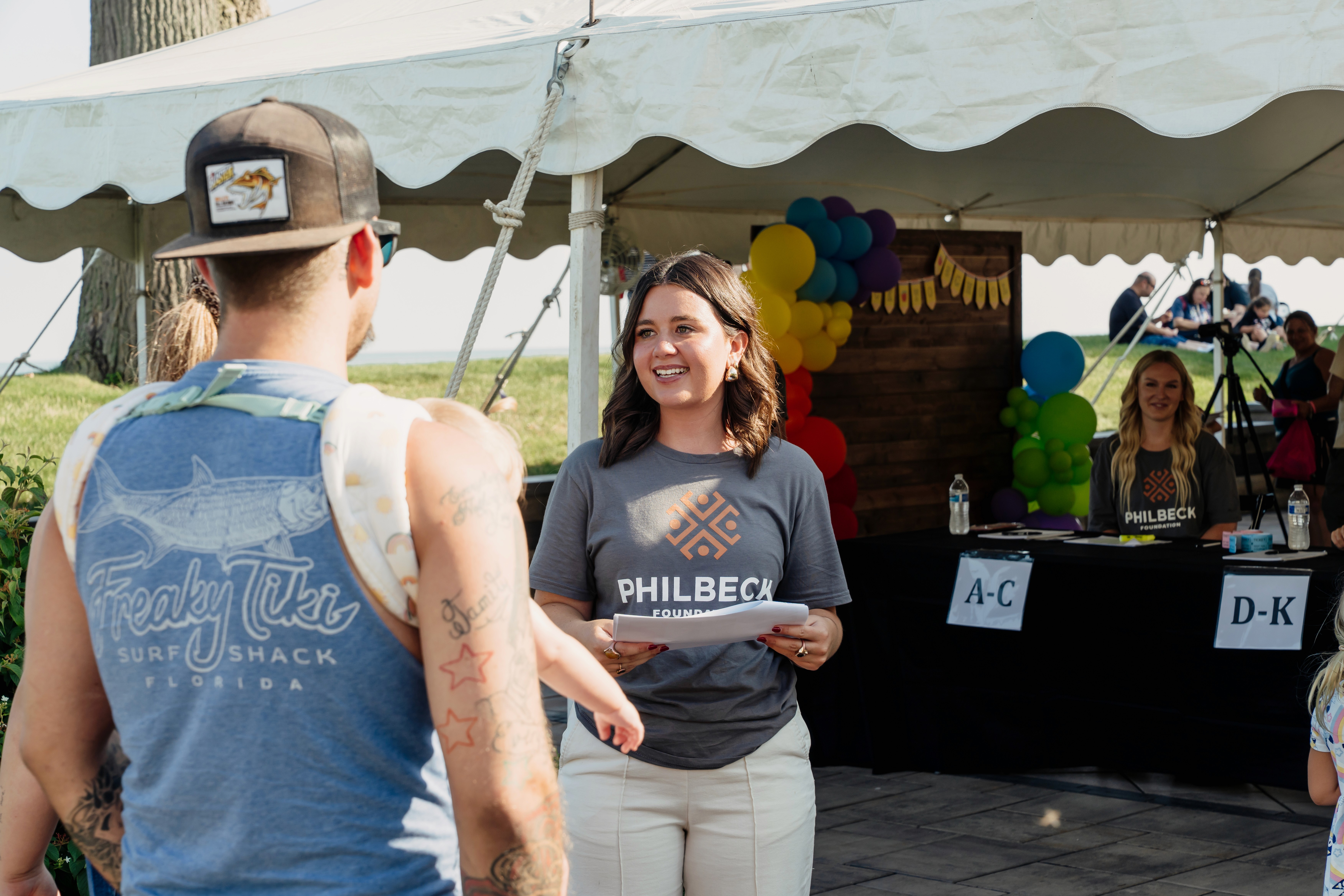 a group of children sitting on steps in front of a building