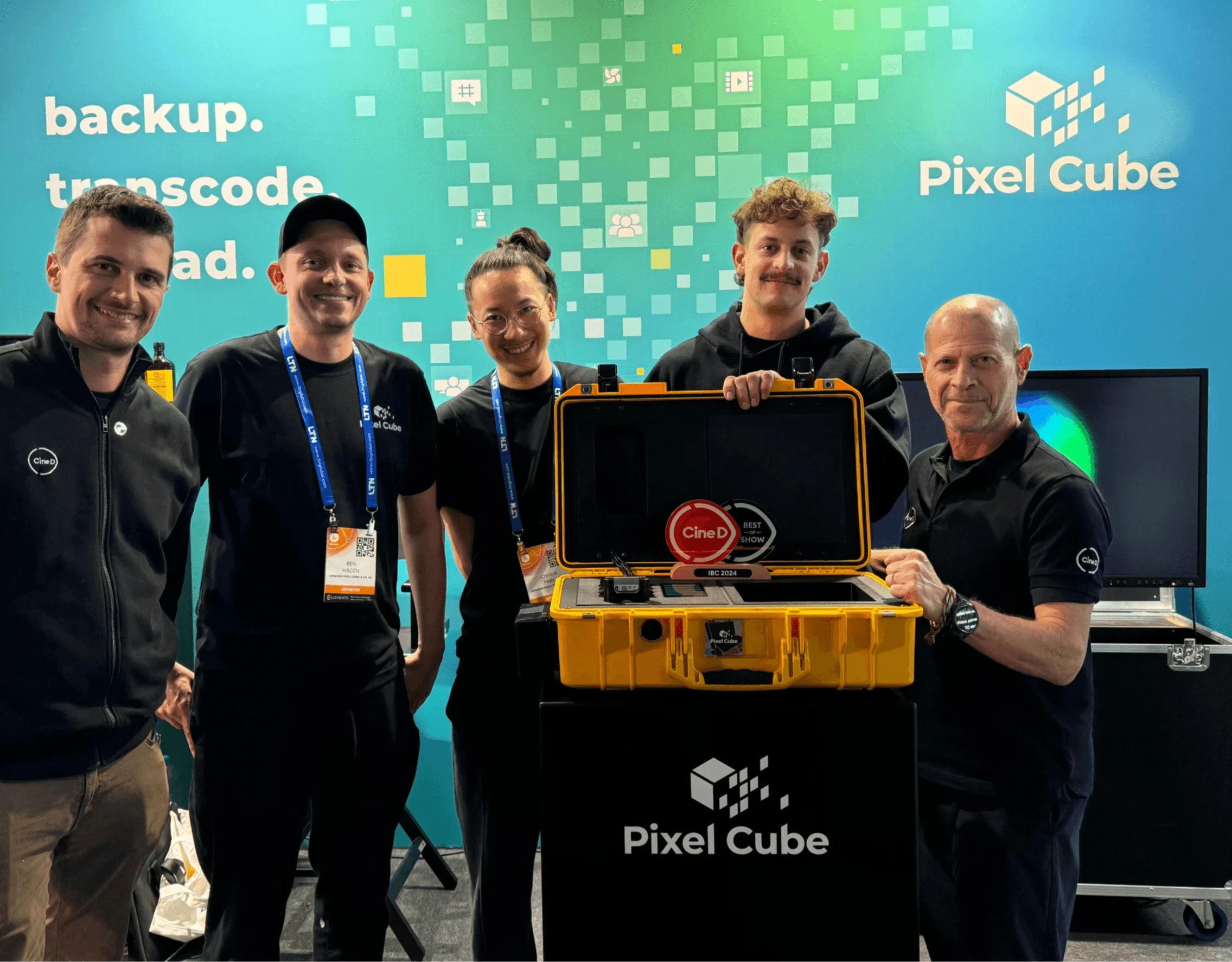 The Pixel Cube team with their yellow Pixel Cube and award