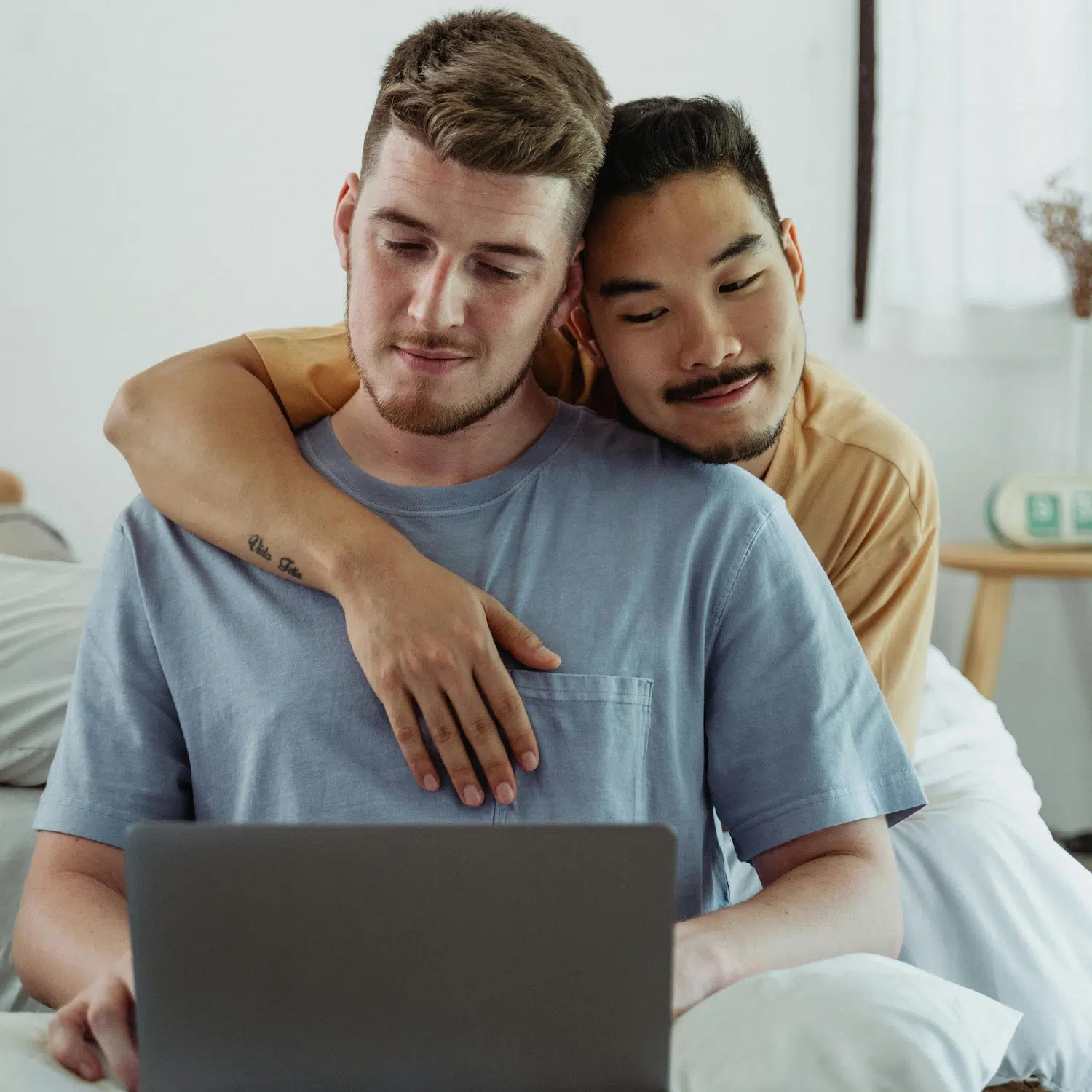 Loving couple relaxing together at home while exploring LGBTQ couples counseling options in Los Angeles to strengthen communication and connection.