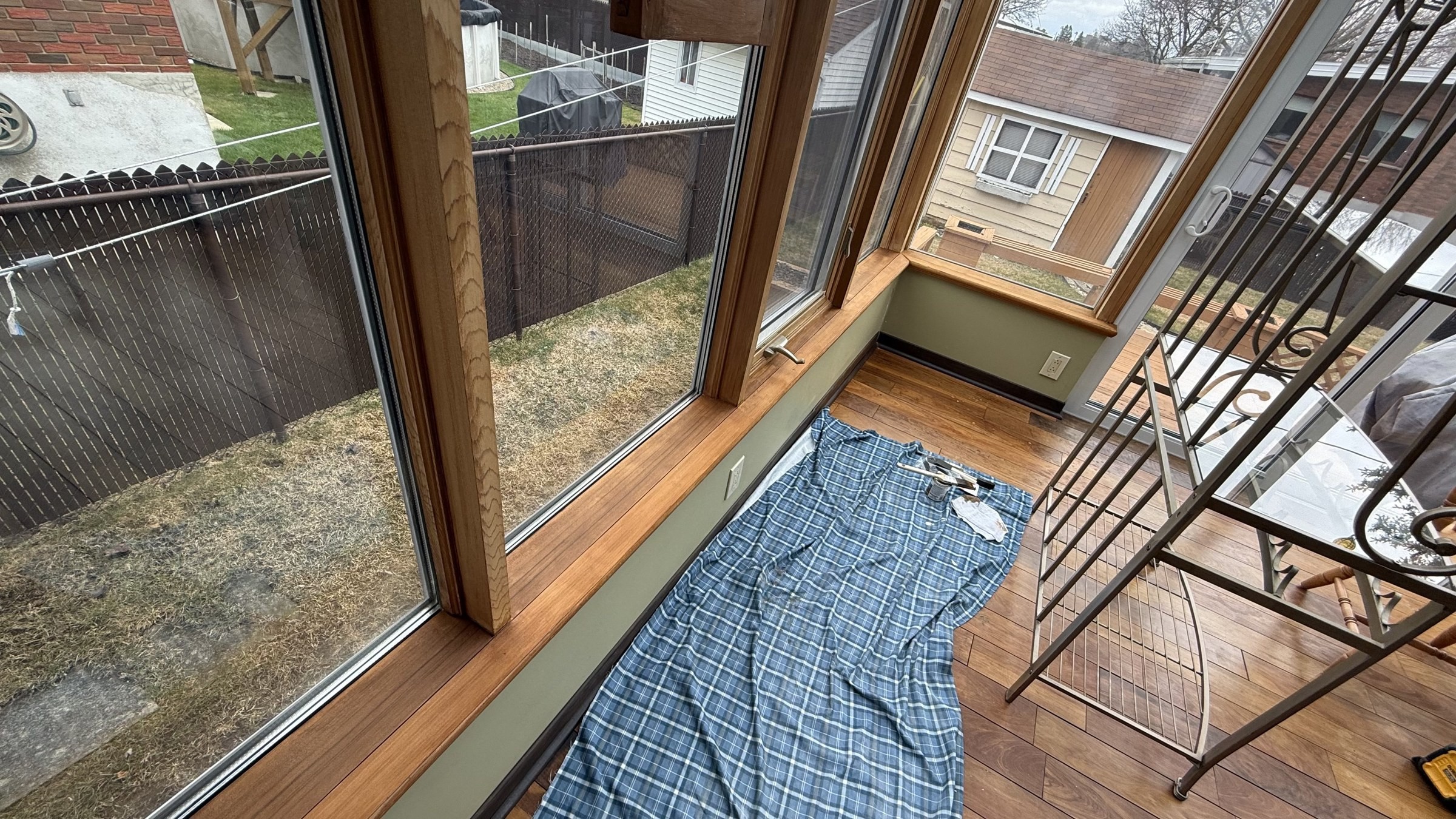 Sunroom sills sanded and restained to an even finish