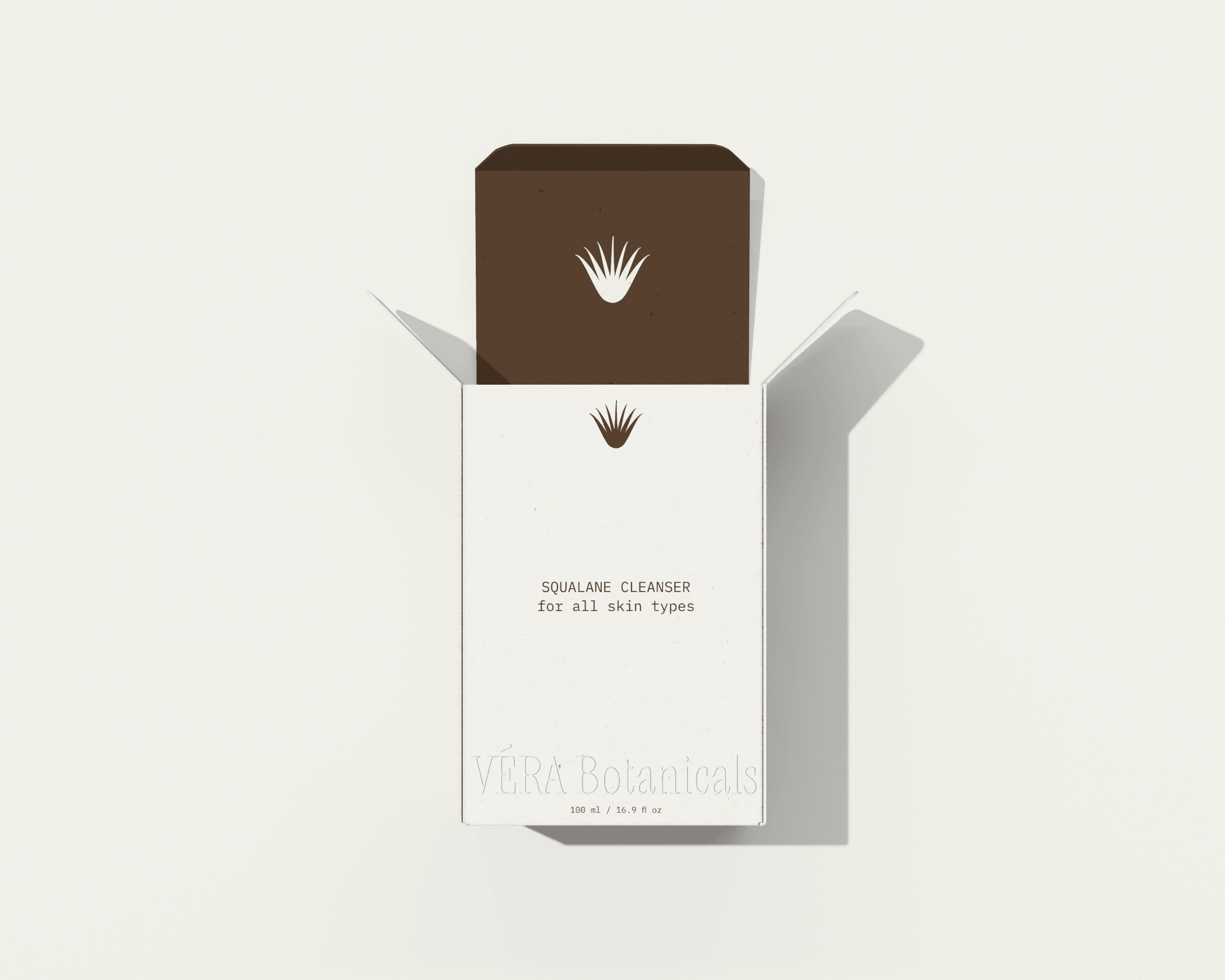 A packaging box design for the organic skincare brand VÉRA Botanicals. The box features the brand logo embossed on the bottom with product details printed in the center of the box.